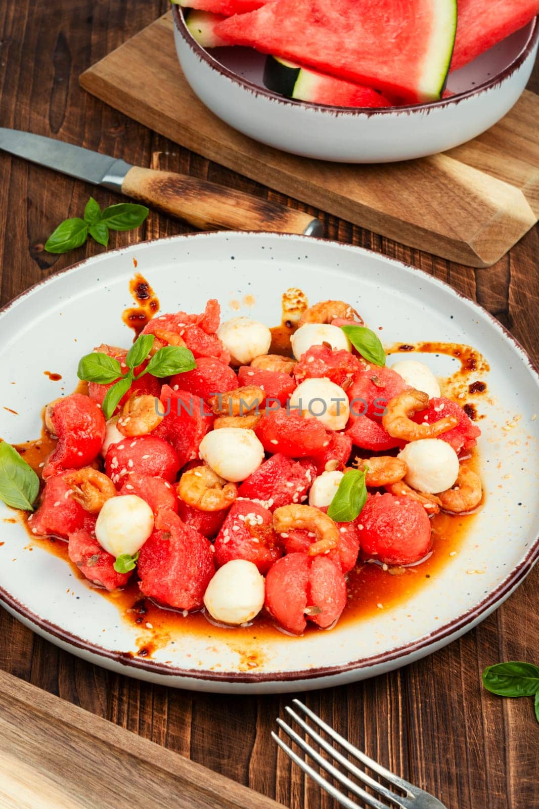 Summer salad with watermelon, mozzarella cheese and shrimp.