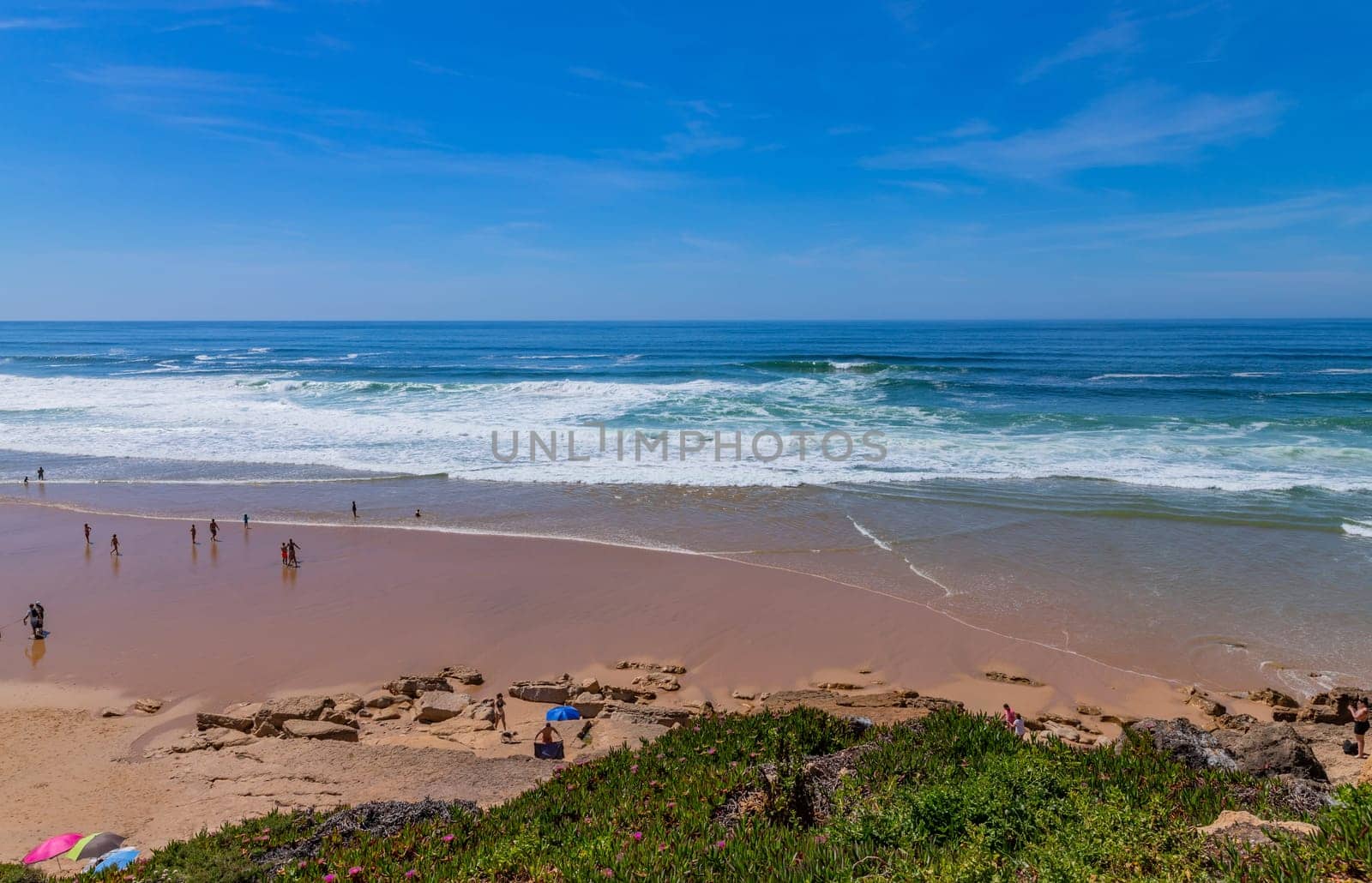 Sintra, Portugal: April 13, 2024: People at the beach of Ericeira, Mafra, Portugal