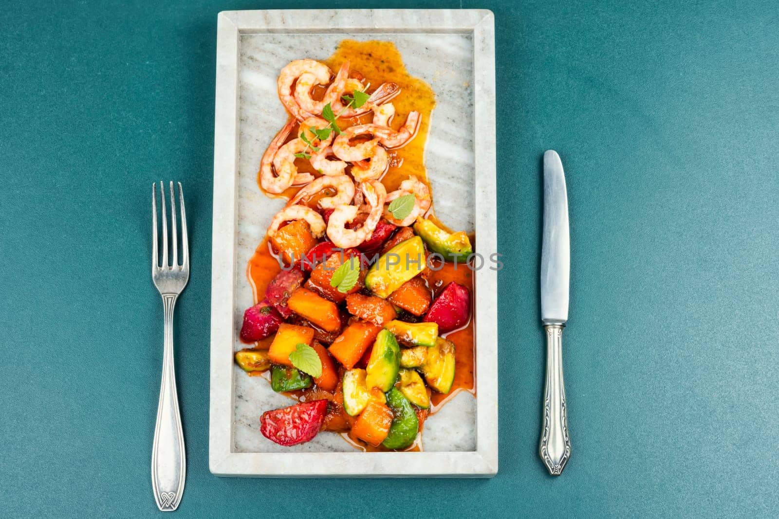 Shrimp with caramelized mango and cactus. The national cuisine of Vietnam.