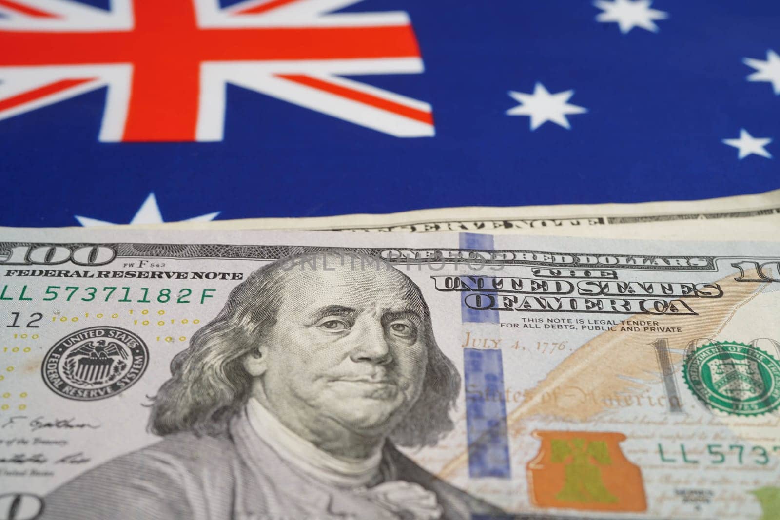 Australia flag with US dollar banknote, finance banking.