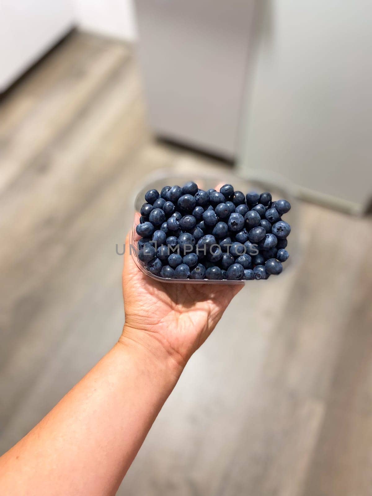 Fresh blueberries on box close-up, background.