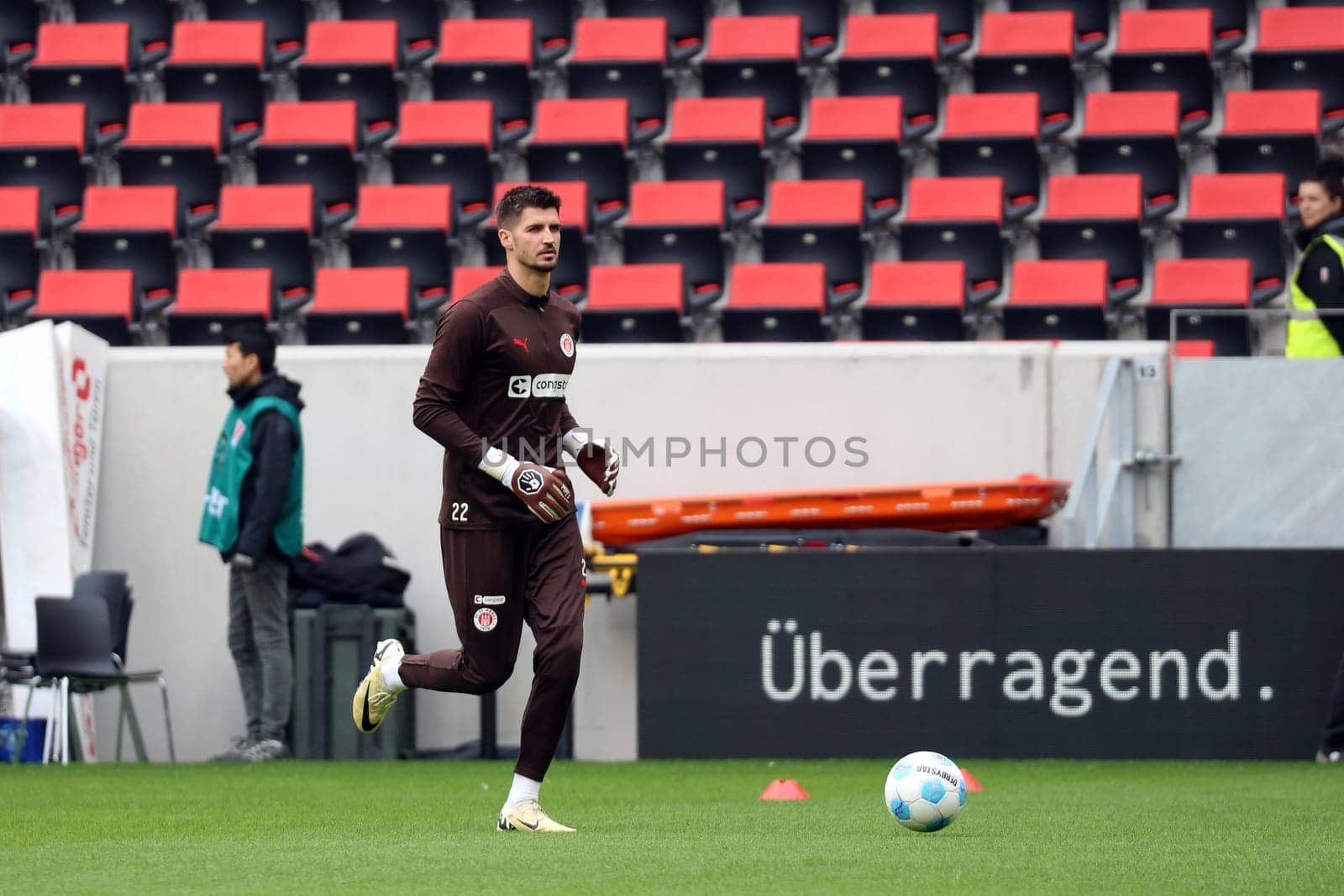 Advertising slogan "outstanding"" applies to goalkeeper Nikola Vasilj (FC St. Pauli) at the match of the 1st FBL: 24-25: 1st FBL: 24-25: 5th Sptg. SC Freiburg - FC St. Pauli  DFL REGULATIONS PROHIBIT ANY USE OF PHOTOGRAPHS AS IMAGE SEQUENCES AND/OR QUASI-VIDEONann  Photo: Joachim Hahne/johapress"