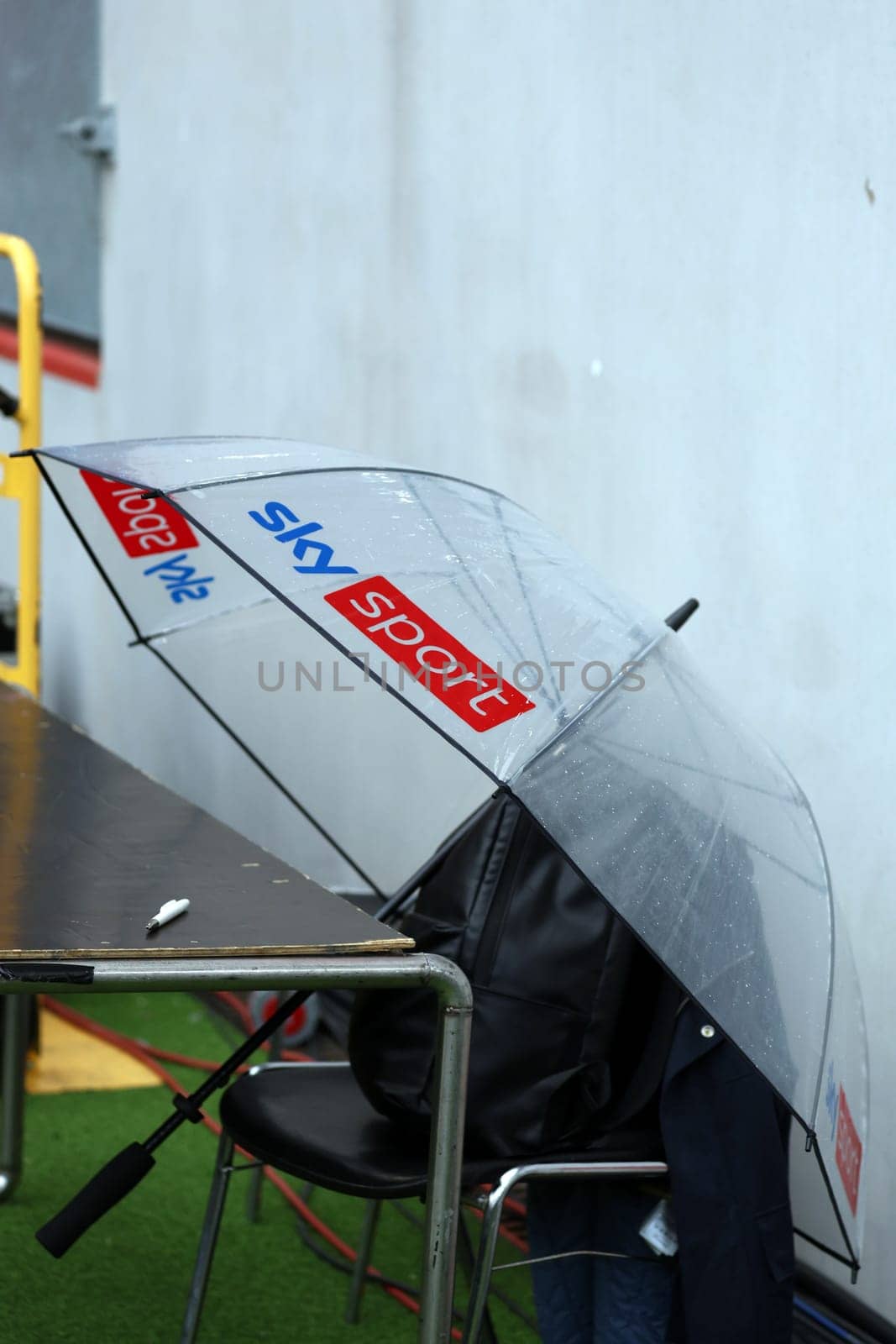 A large umbrella from the TV channel SKY lies on the edge of the pitch at the match of the 1st FBL: 24-25: 1. FBL: 24-25: 5. Sptg. SC Freiburg - FC St. Pauli  DFL REGULATIONS PROHIBIT ANY USE OF PHOTOGRAPHS AS IMAGE SEQUENCES AND/OR QUASI-VIDEONann  Photo: Joachim Hahne/johapress
