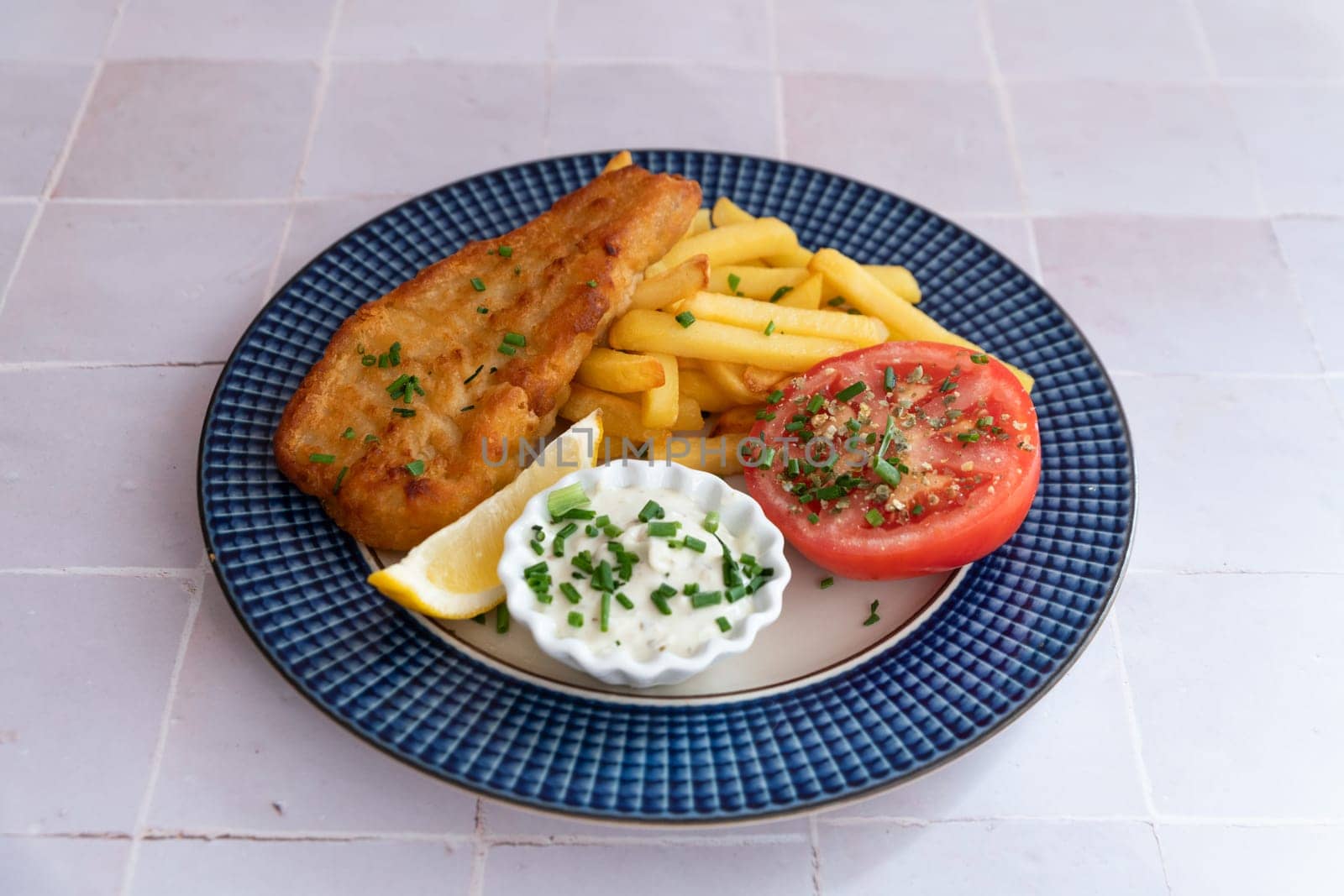 famous british hot plate named fish and chips