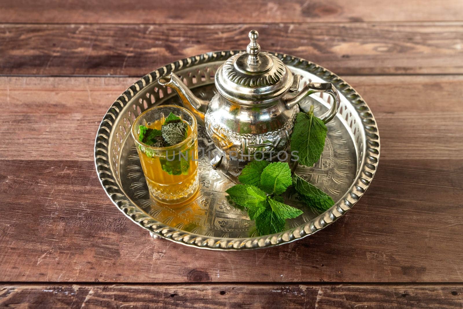beautiful oriental and traditional green minth tea on a plate