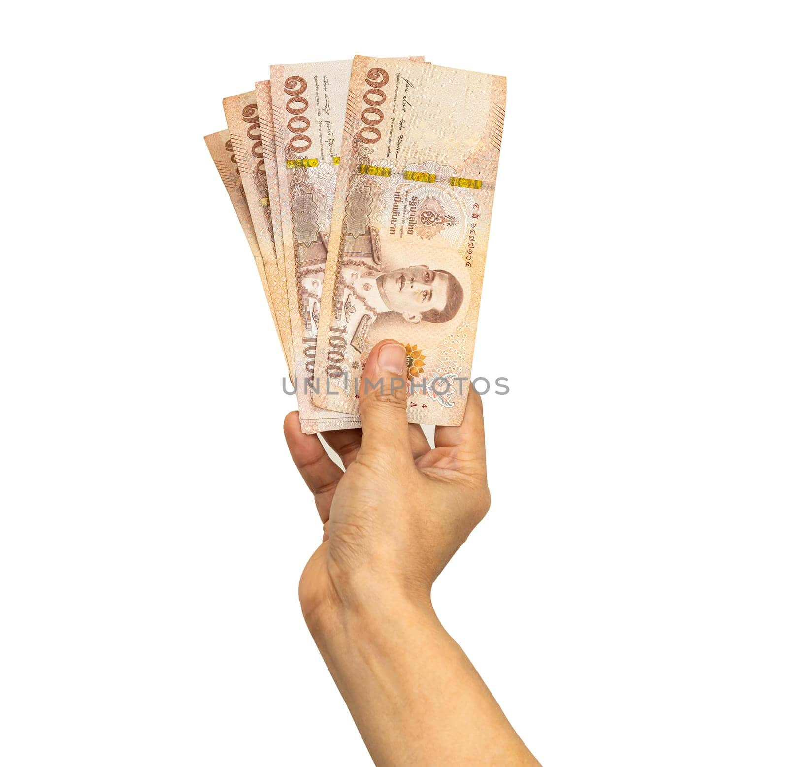 Thai baht banknotes cash money in woman hand isolated on white background with clipping path.