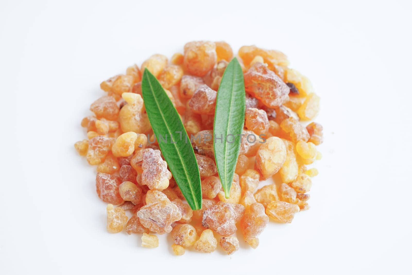 Frankincense or olibanum aromatic resin isolated on white background used in incense and perfumes.