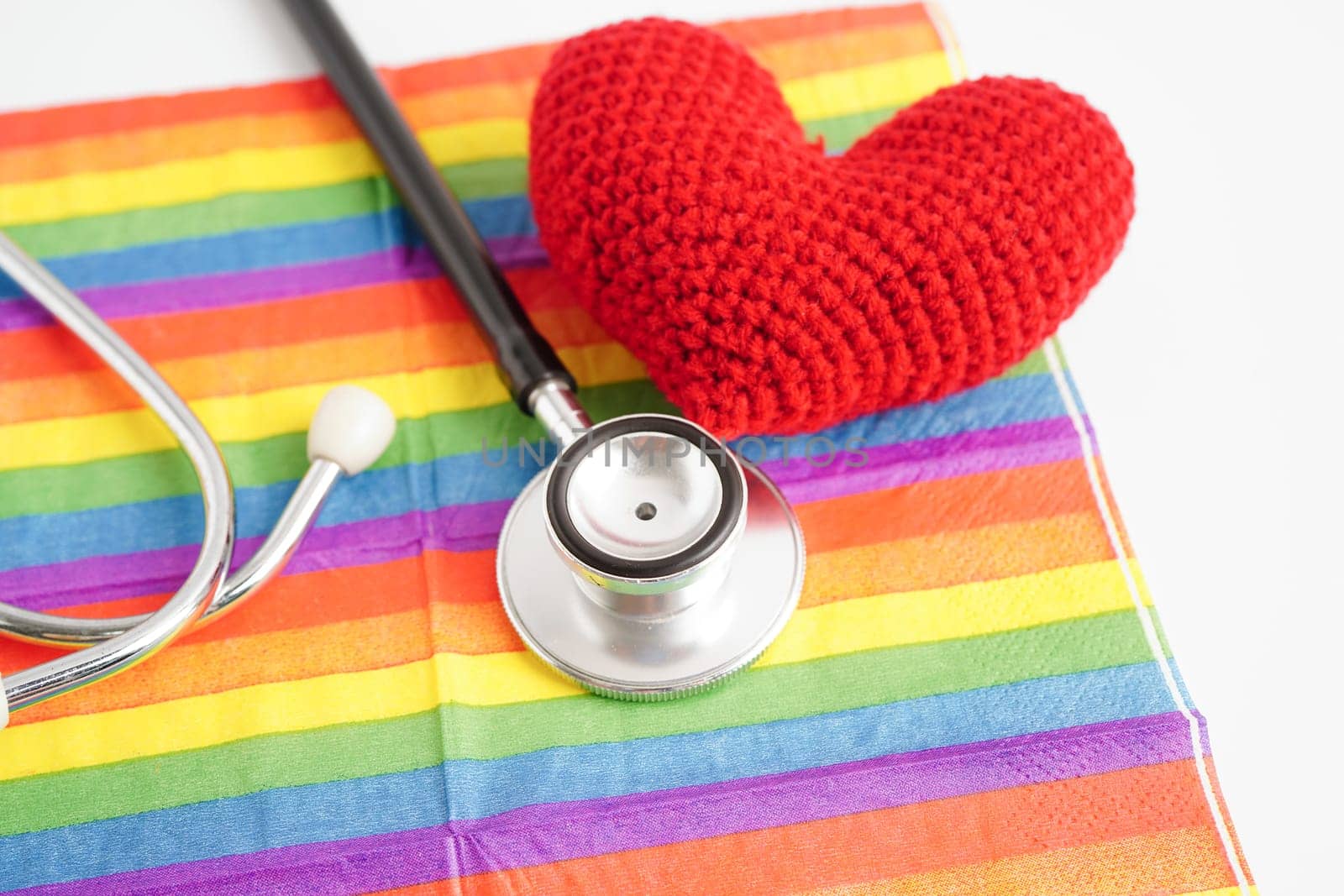 LGBT symbol, Stethoscope with red heart on rainbow flag, rights and gender equality, LGBT Pride Month in June.