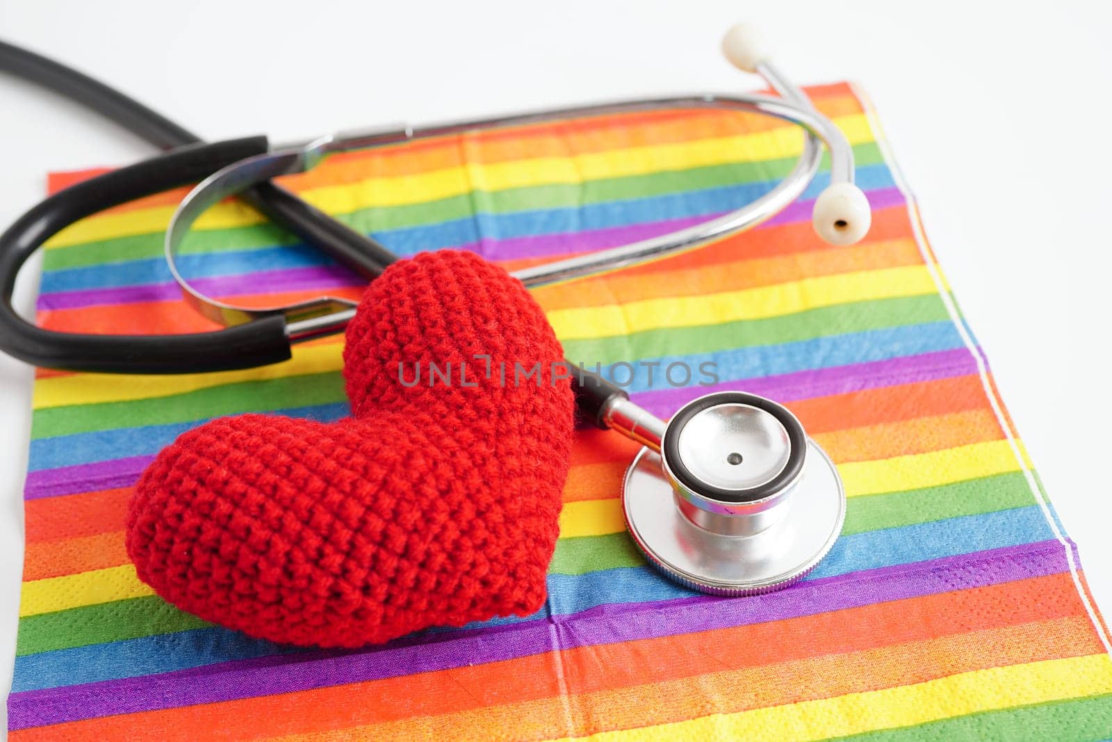 LGBT symbol, Stethoscope with red heart on rainbow flag, rights and gender equality, LGBT Pride Month in June.