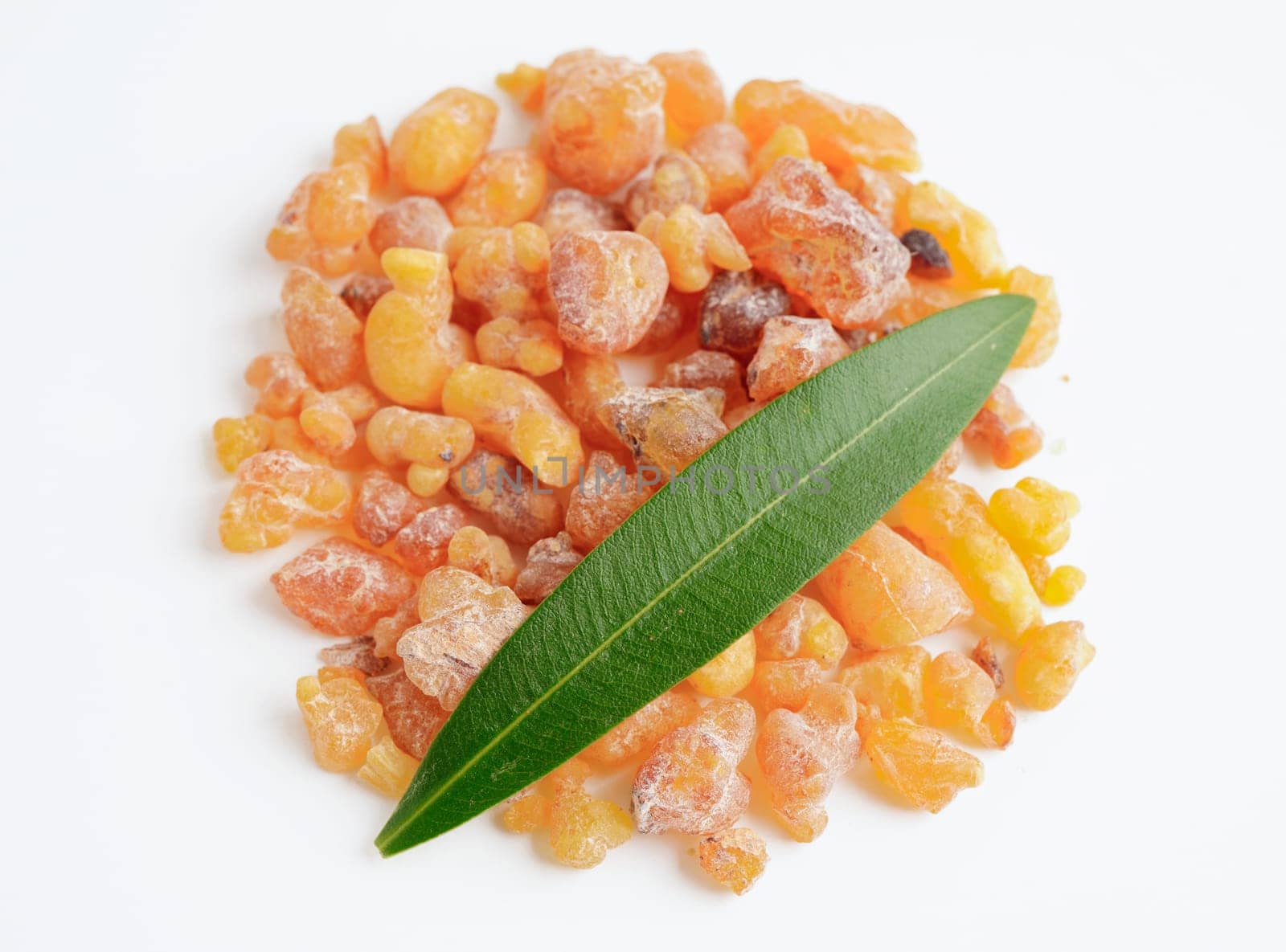 Frankincense or olibanum aromatic resin isolated on white background used in incense and perfumes.