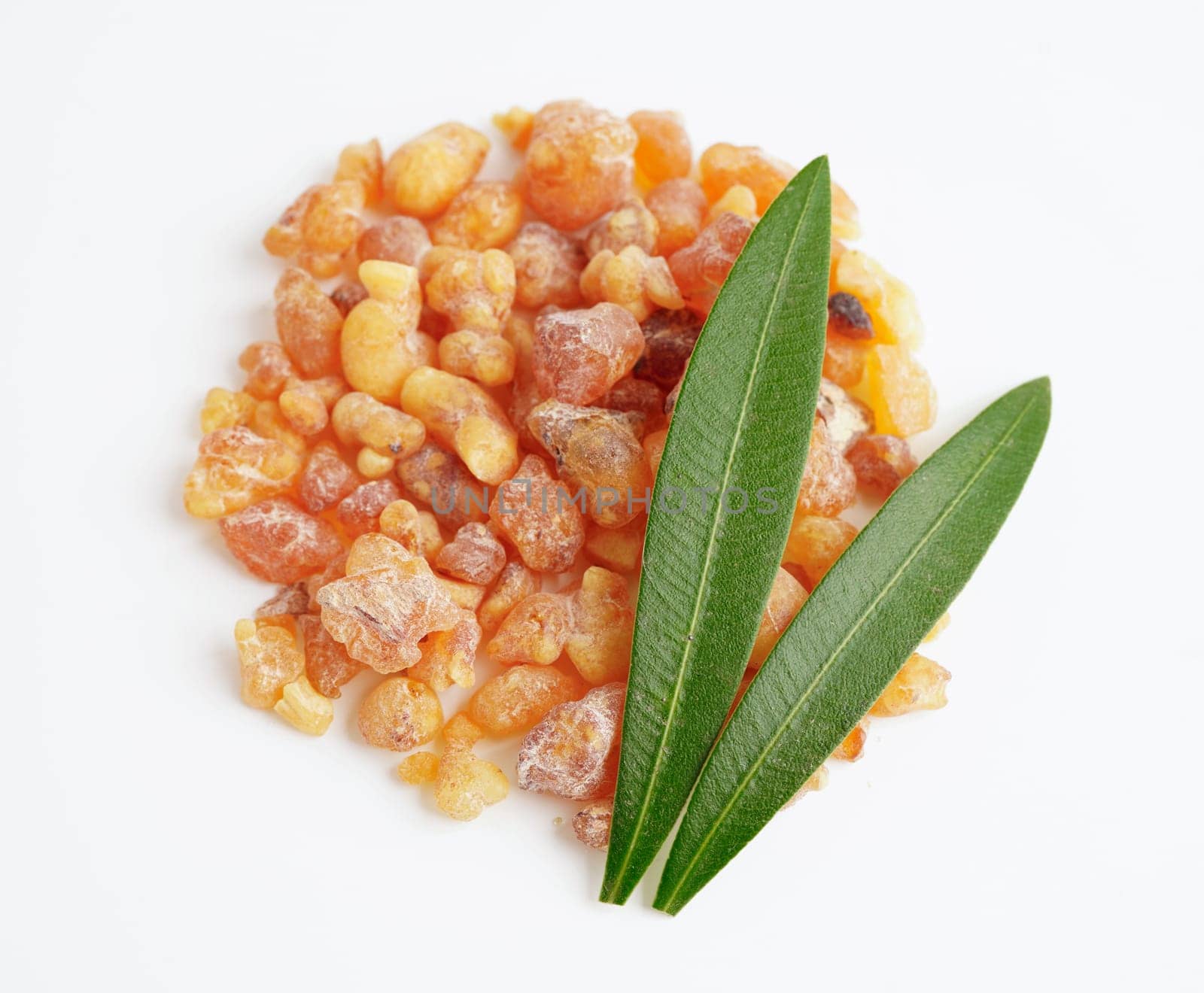 Frankincense or olibanum aromatic resin isolated on white background used in incense and perfumes.