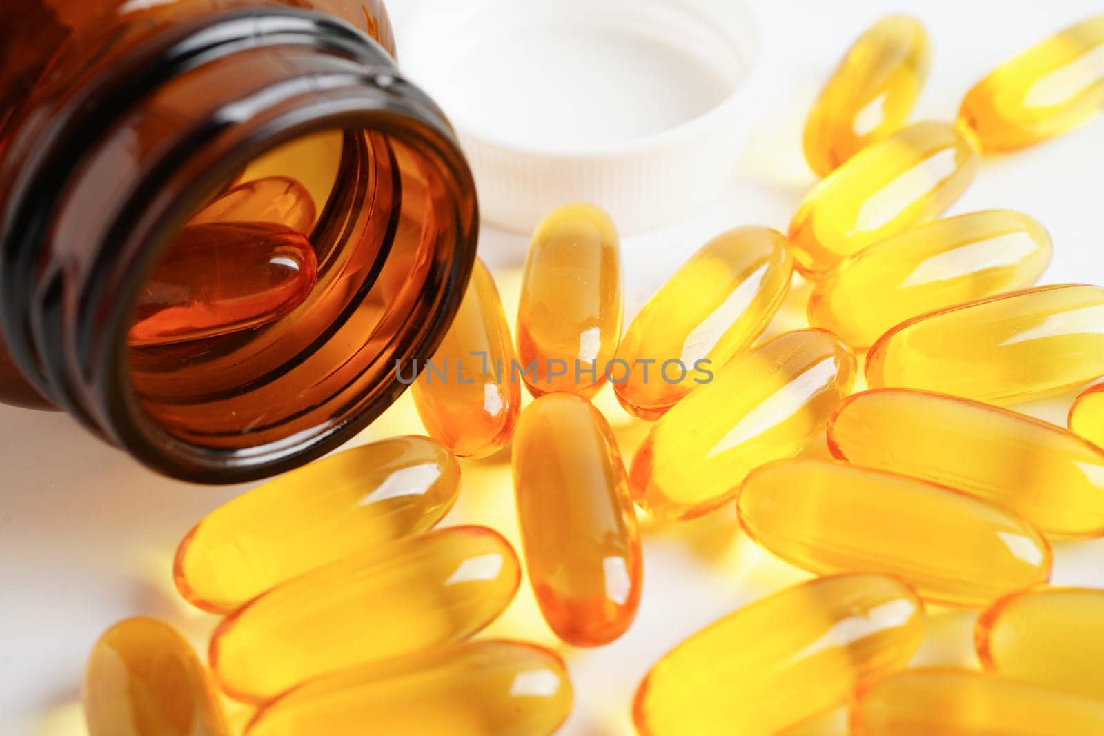 Fish oil or Cod liver oil gel in capsules with omega 3 vitamins, supplementary healthy food
