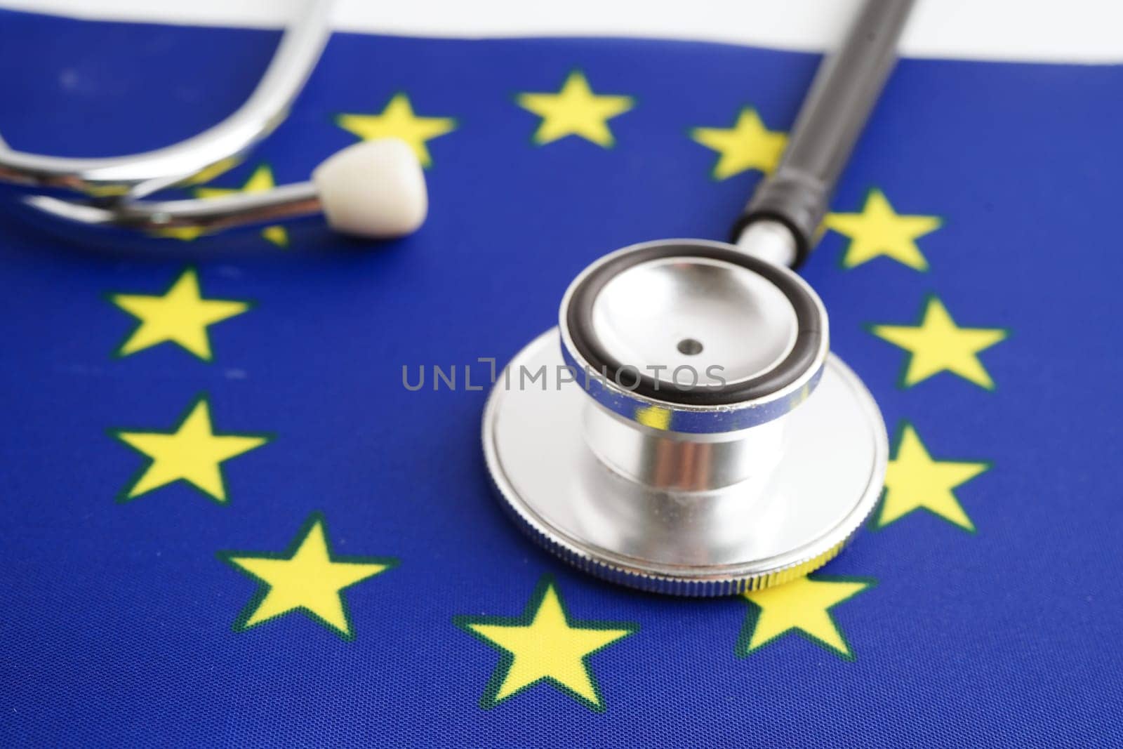 EU flag with black stethoscope, Business and finance concept.