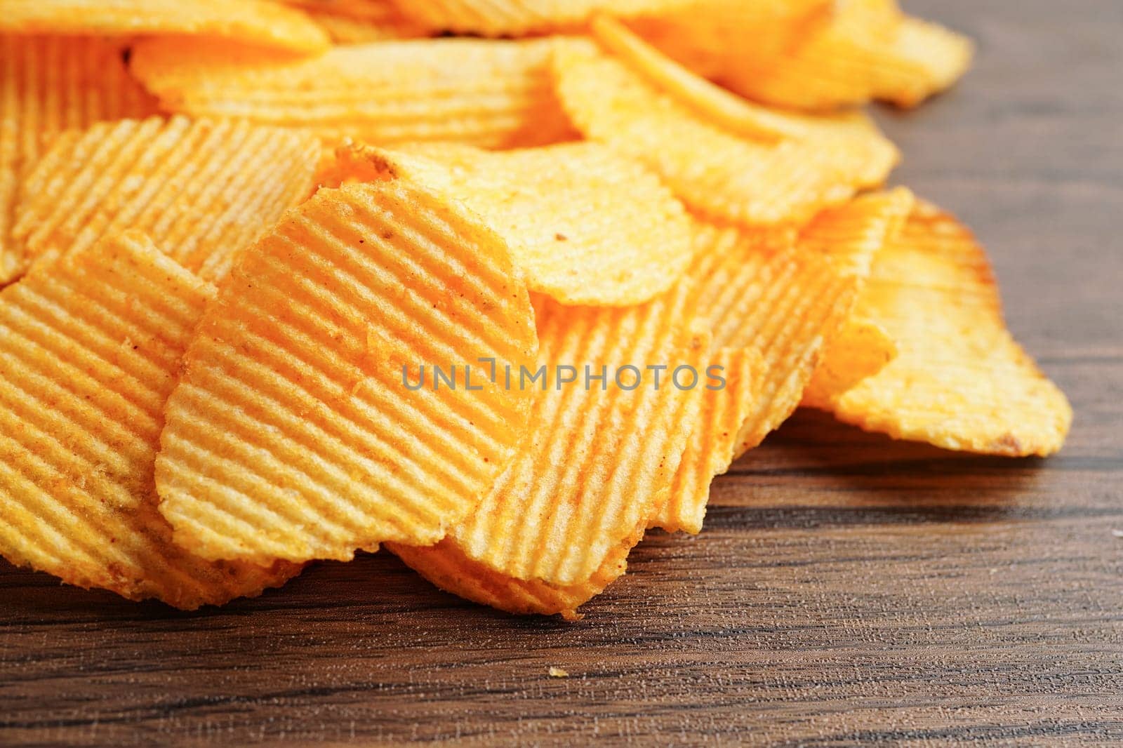 Potato chips , delicious BBQ seasoning spicy for crips, thin slice deep fried snack fast food.