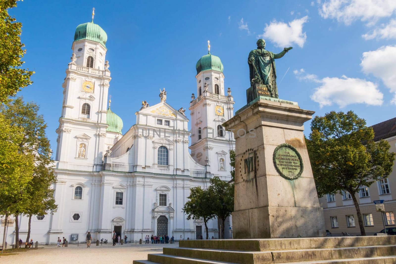 Passau, Germany- September 20 2024: St. Stephen's Cathedral and Maximilian Joseph statue in Passau, Bavaria, Germany