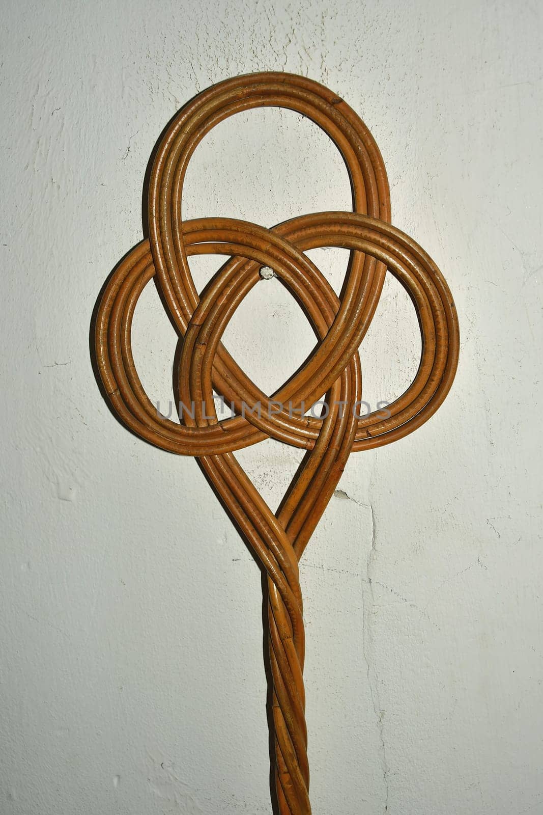 old carpet beater on a cellar wall in a German house