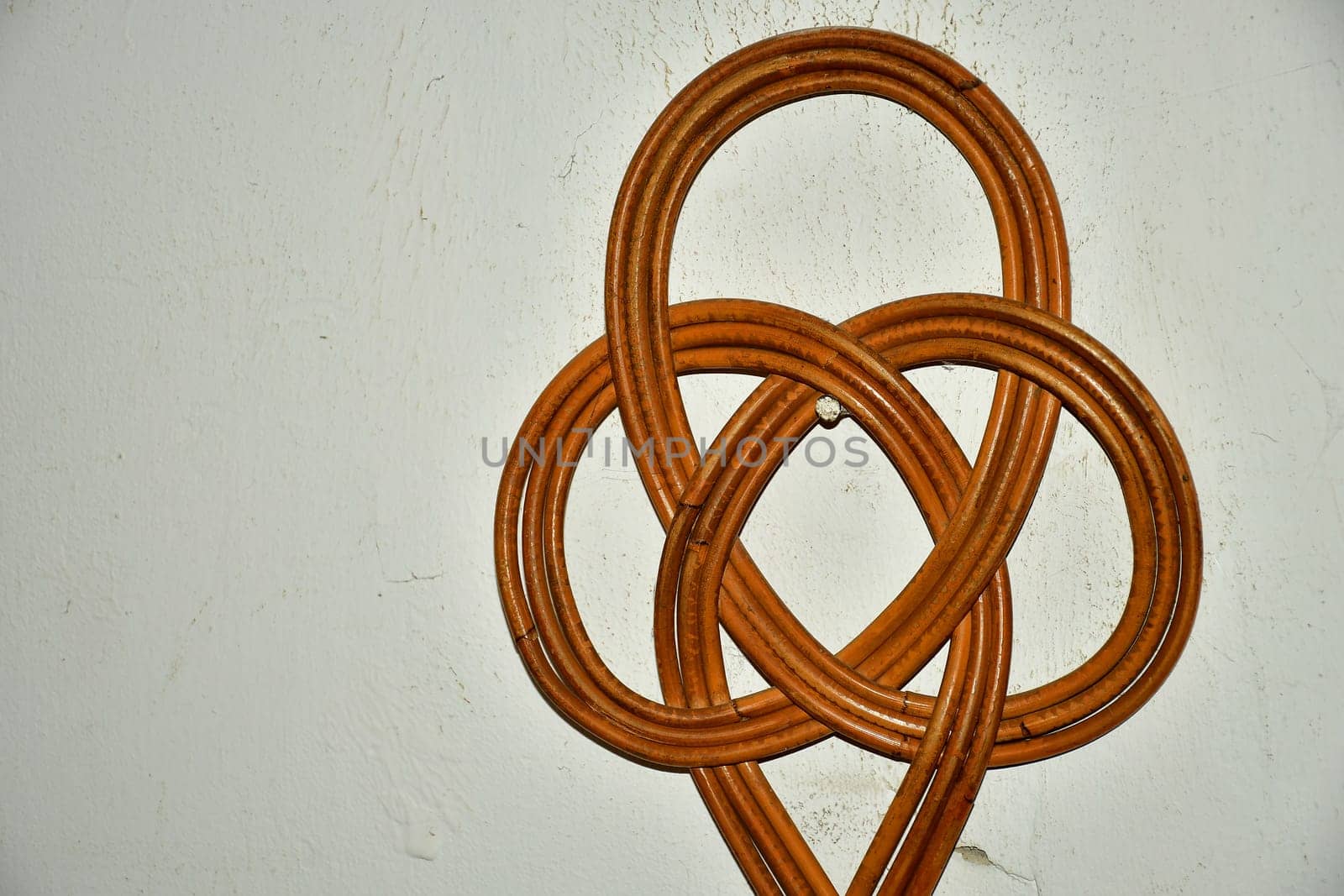 old carpet beater on a cellar wall in a German house
