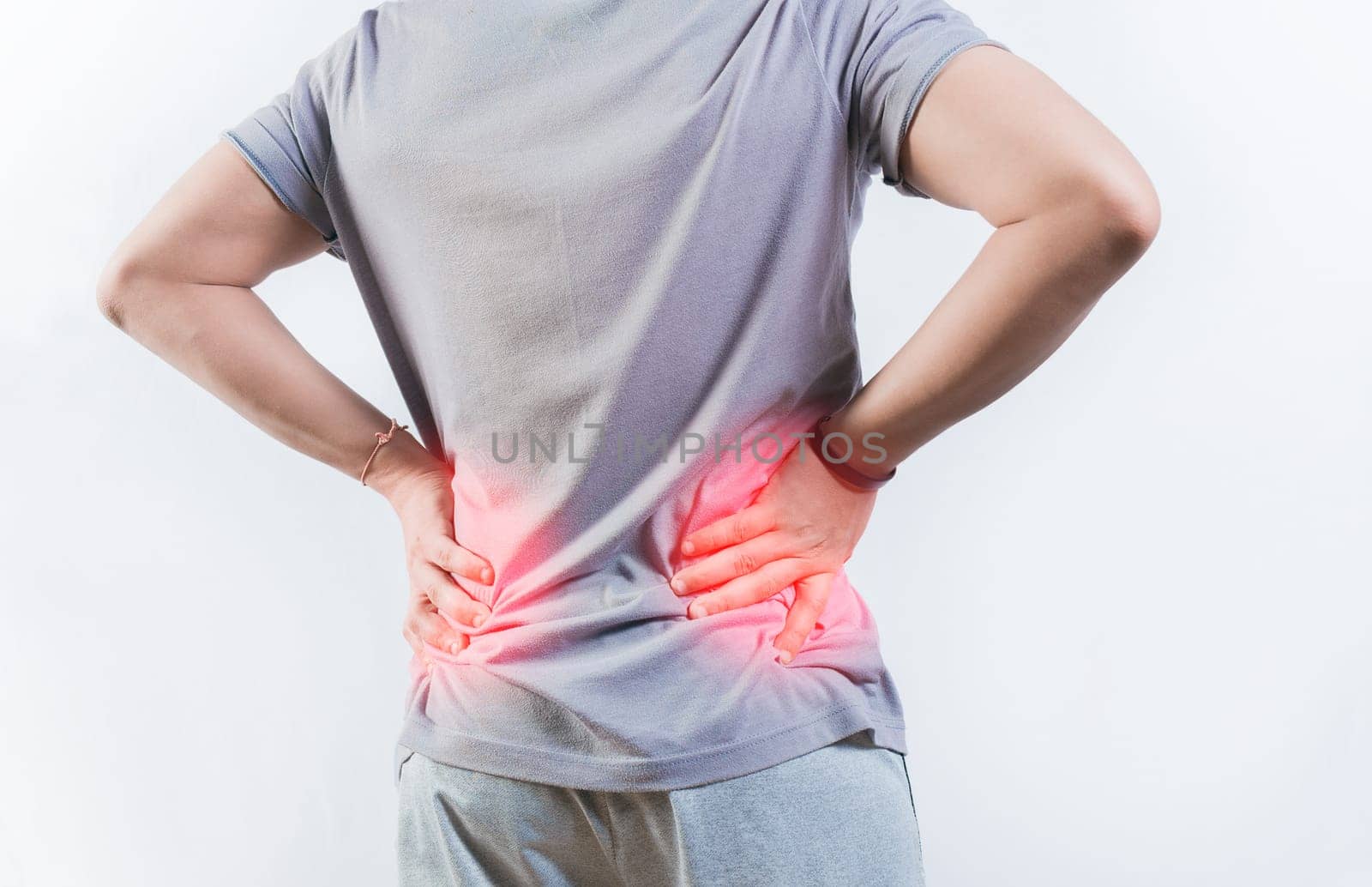 Person with spine problems isolated. Rear view of person with back ache isolated. Lumbar problems concept