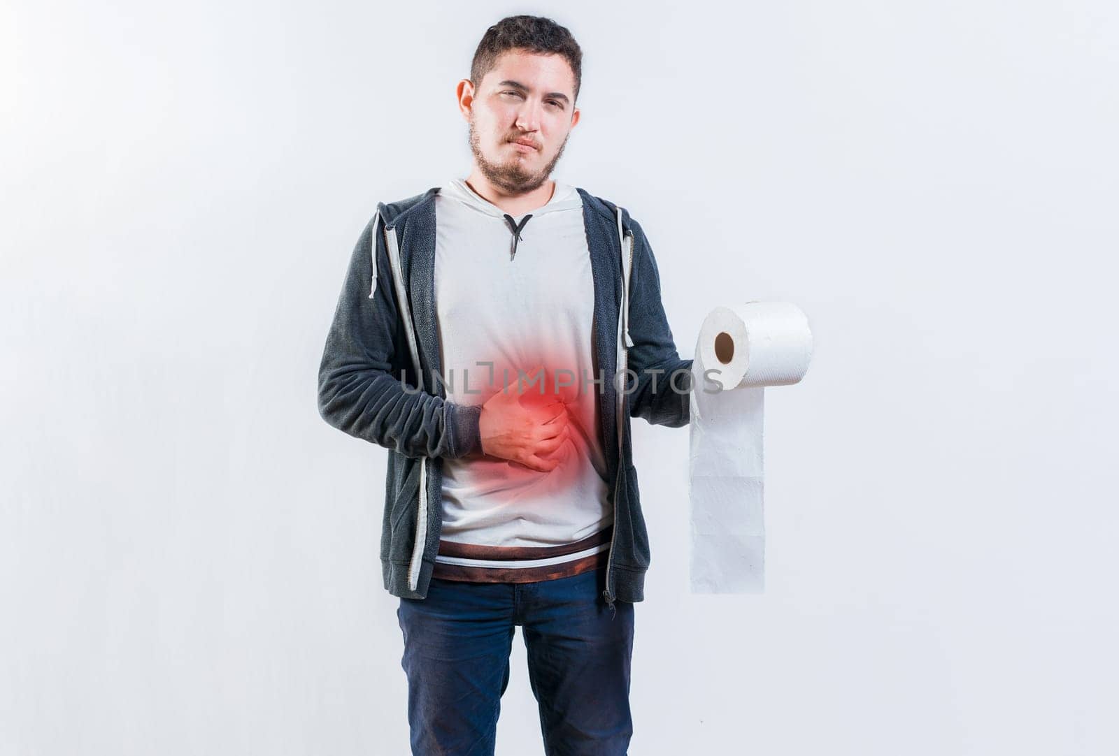 Person with diarrhea and stomach problems holding toilet paper. Man suffering with stomach pain holding roll of paper isolated