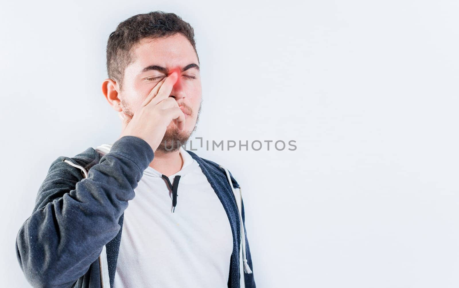 Person with sinusitis and nasal inflammation. Man with nasal congestion isolated