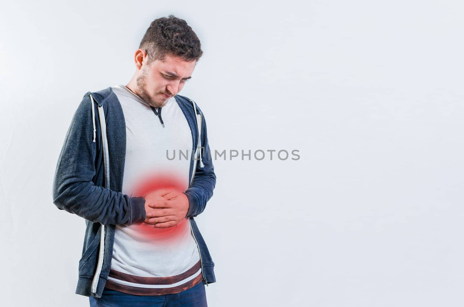 Unhappy man with digestive problems isolated. Person with digestive and stomach problems isolated