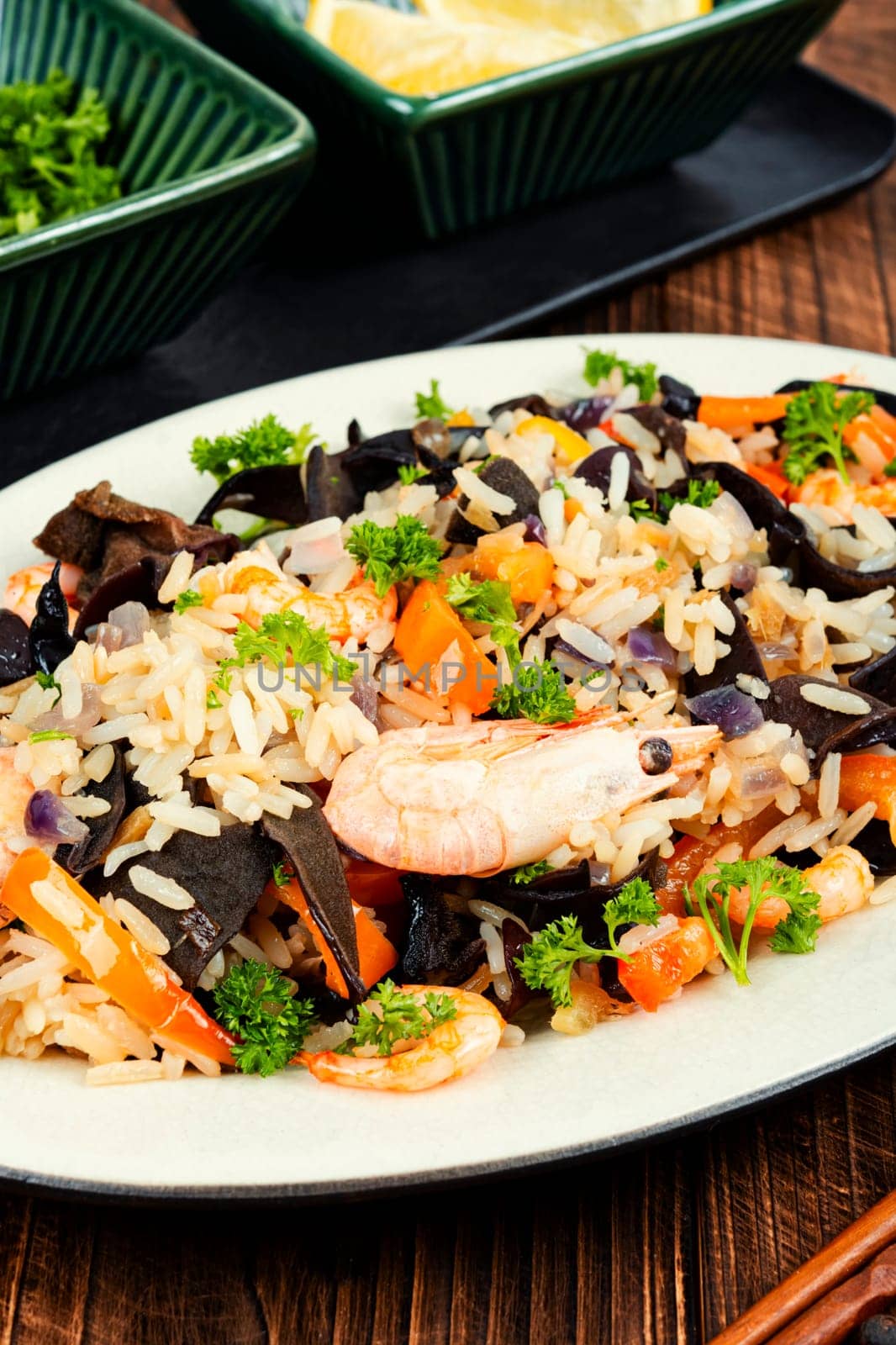 Traditional Chinese food, fried rice with shrimp and mushrooms.