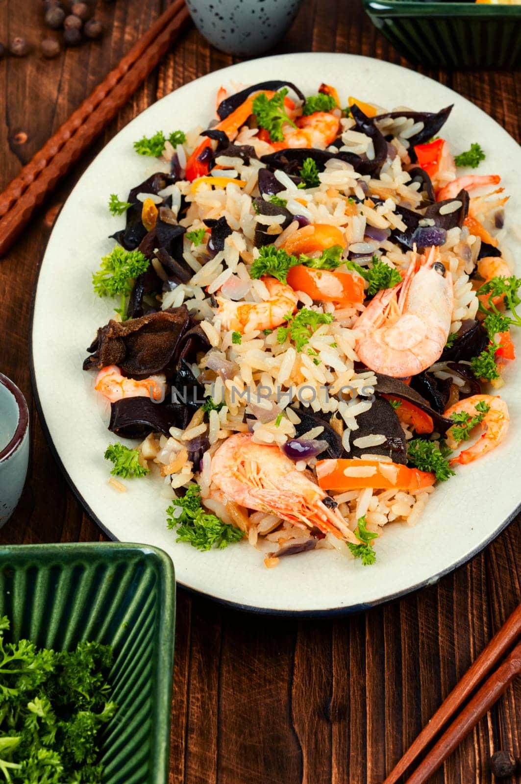 Traditional Chinese food, fried rice with shrimp and mushrooms.
