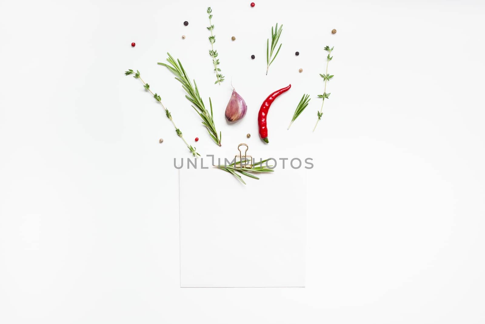 Flat lay overhead view blank notebook pages mockup text space invitation card on white background with greens herbs and spices. Menu or recipe book or food blog design with cooking ingredients
