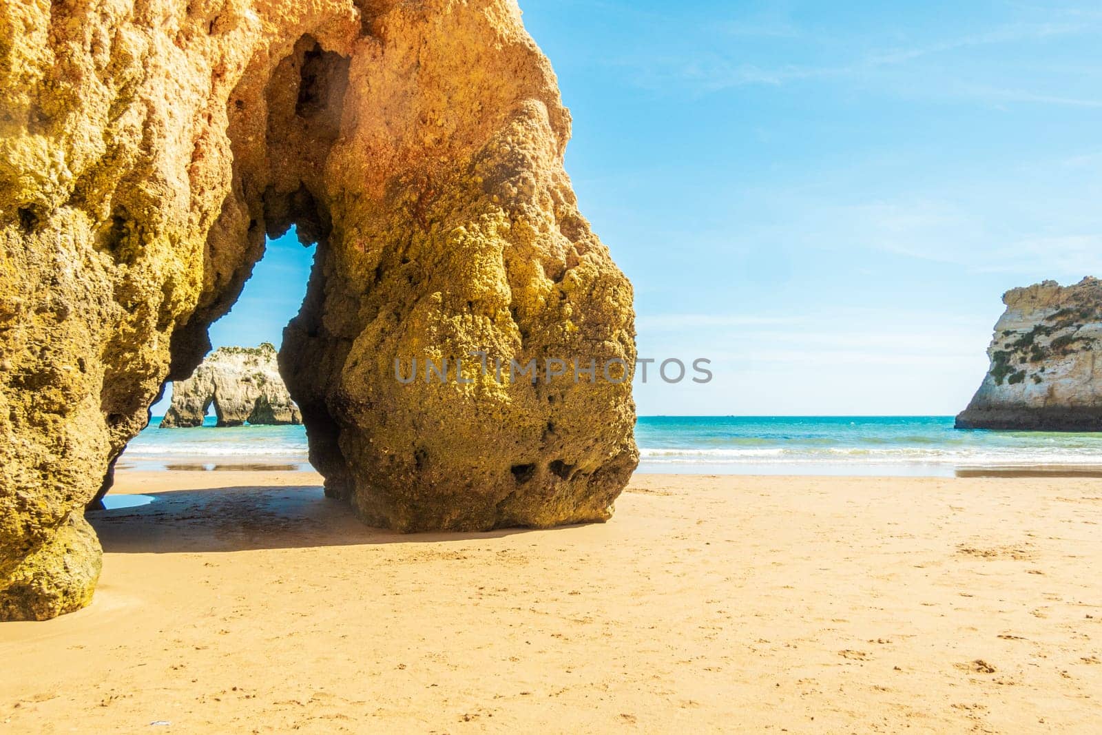 Beach and rugged coastline, photographed in the Algarve region of Portugal