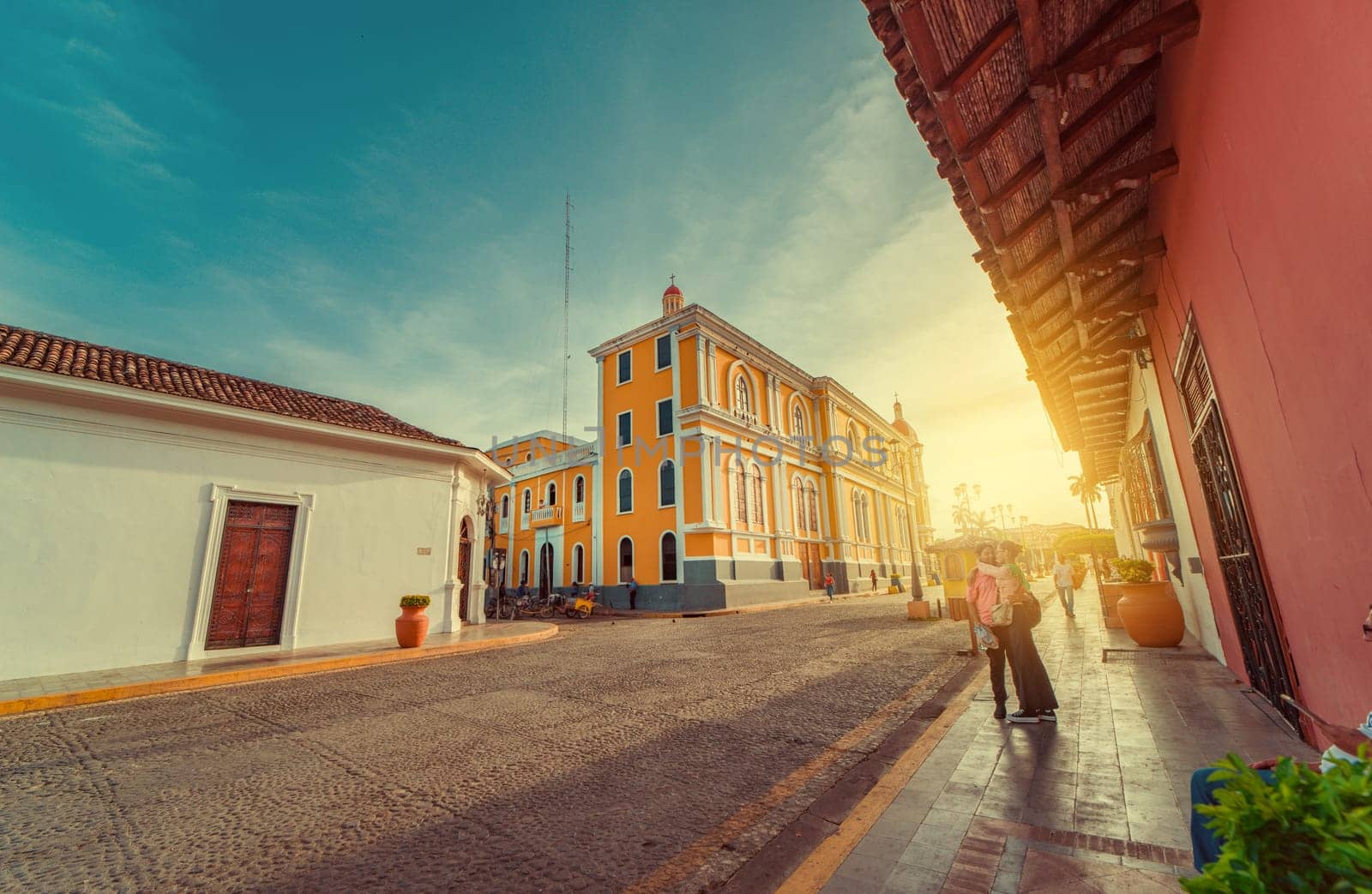 People walking through the cathedral of Granada that leads to La Calzada street. Granada, Nicaragua. 05-10-2024