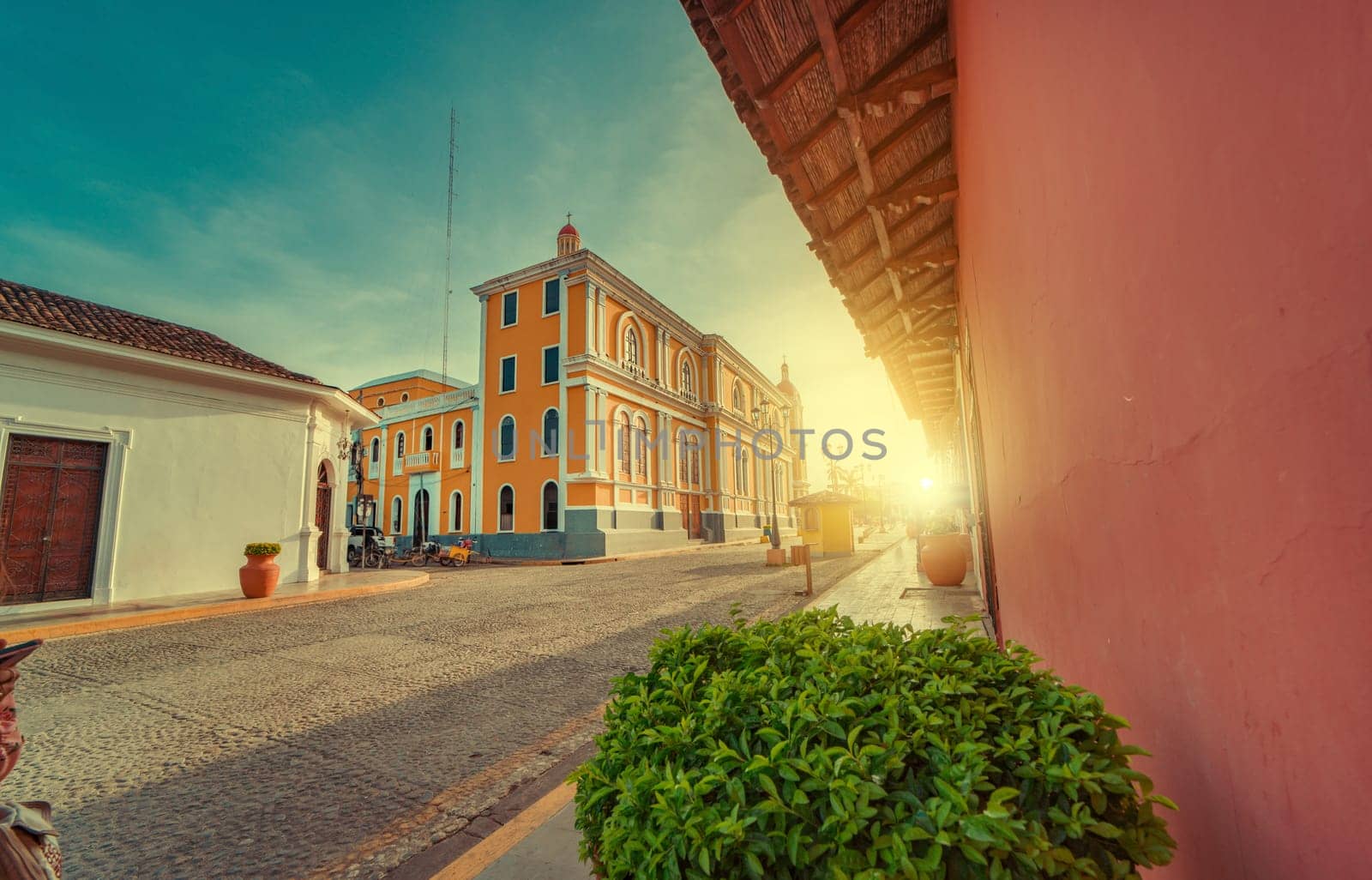 View of the street of the cathedral of Granada Nicaragua leading to La Calzada at sunset