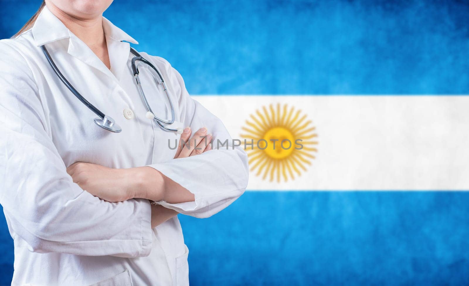 Argentine Health and Care concept. Female doctor holding stethoscope with Argentina flag