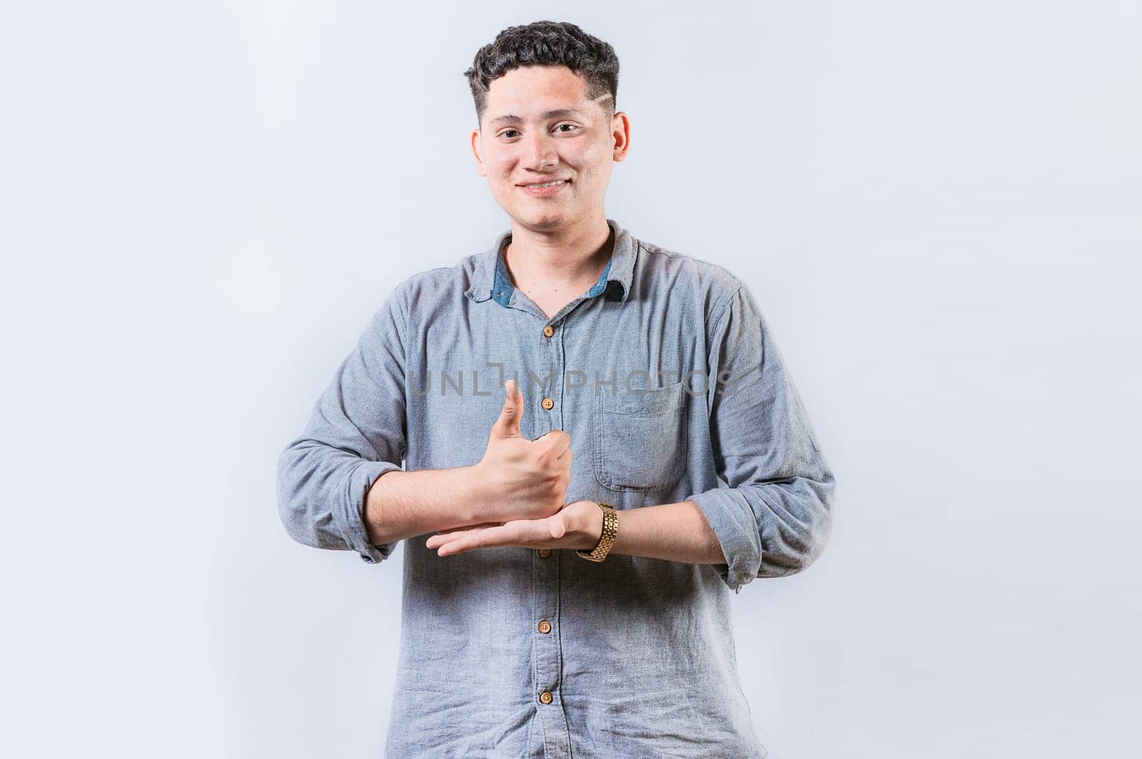 Person gesturing HELP with hands in sign language. Smiling interpreter gesturing HELP with hands in sign language isolated
