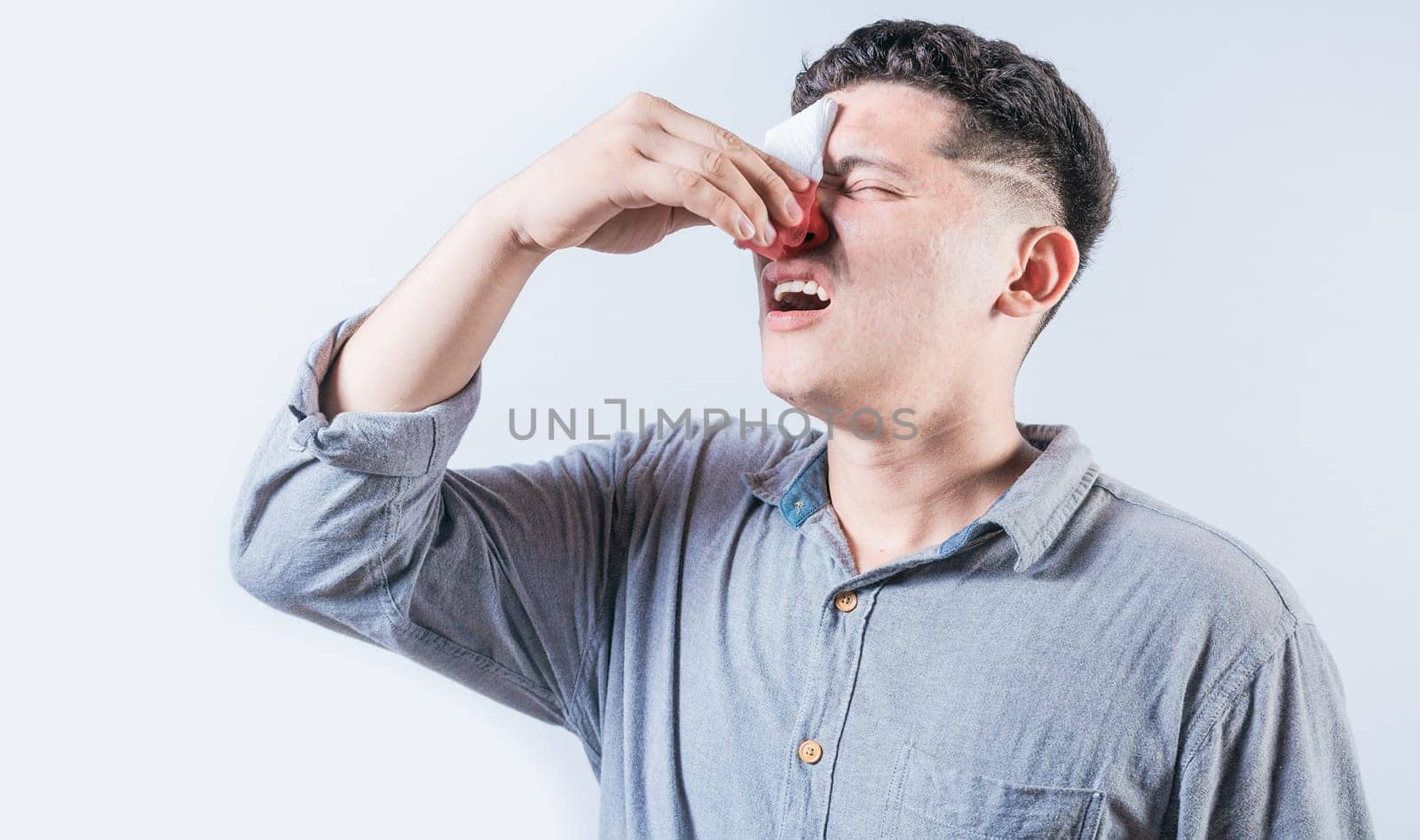 Man suffering from sinusitis isolated. People suffering with irritated nose isolated. Concept of nasal congestion