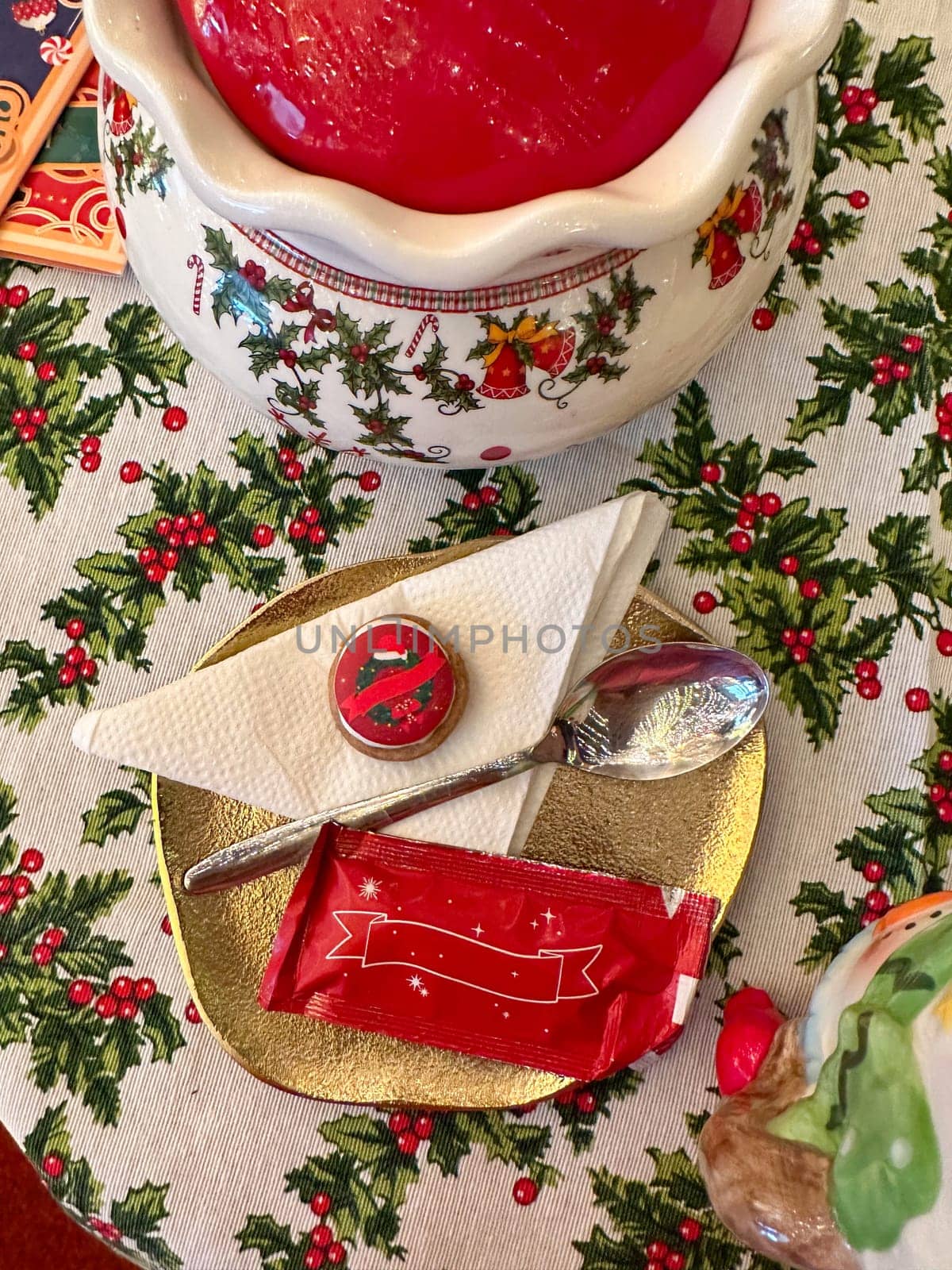 Festive dessert table with holiday-themed decorations. a warm crumble topped with a scoop of ice cream and a Christmas tree decoration captures the cozy atmosphere of a winter celebration. Festive and joyful winter celebrations. Xmas treats.