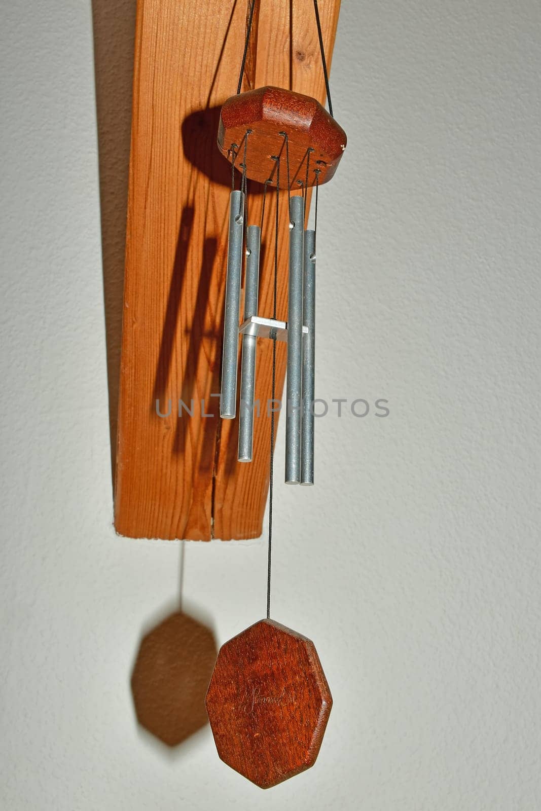 wind chime in a room with shadows