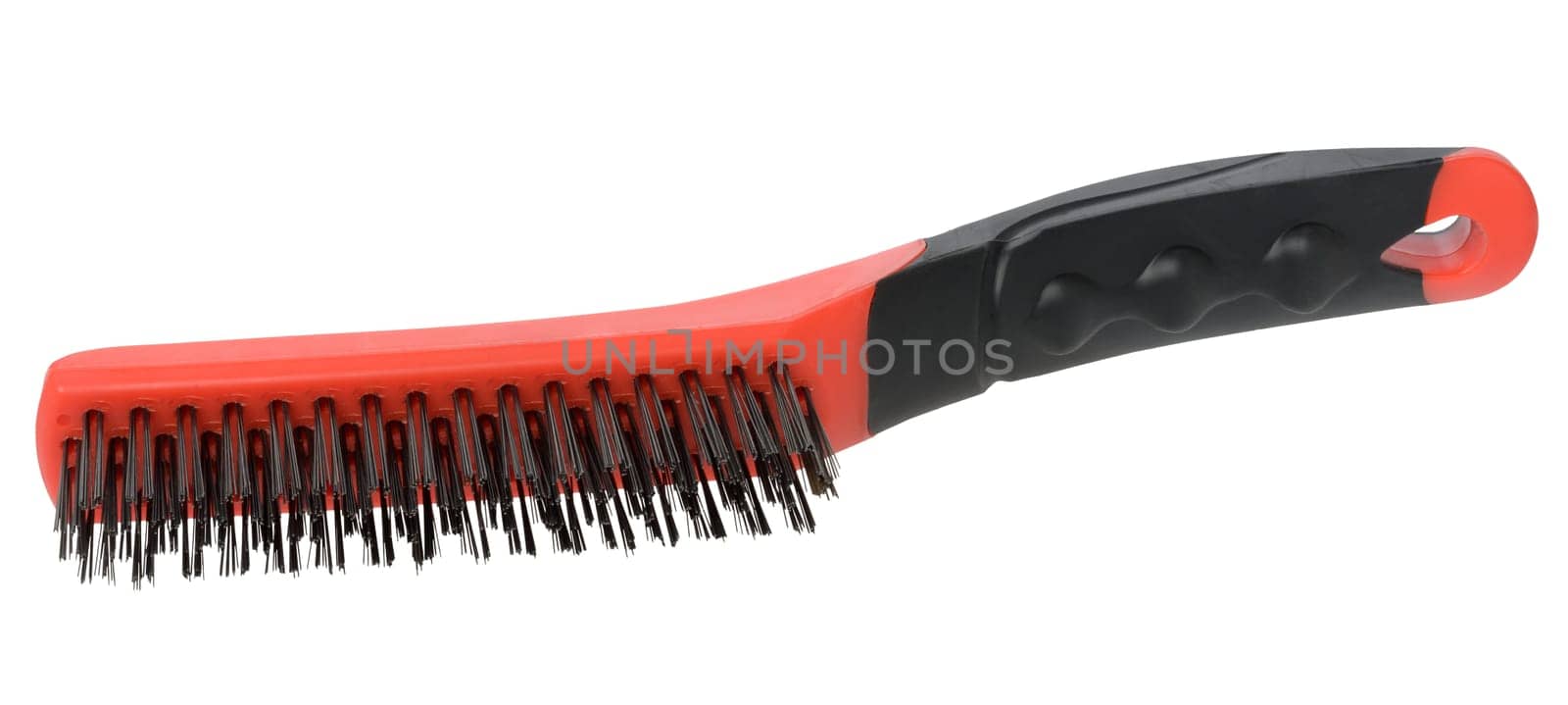 Wire brush for metalworking with a red-black handle and metal bristles on an isolated background. Designed for removing rust, cleaning welds or cleaning metal surfaces.
