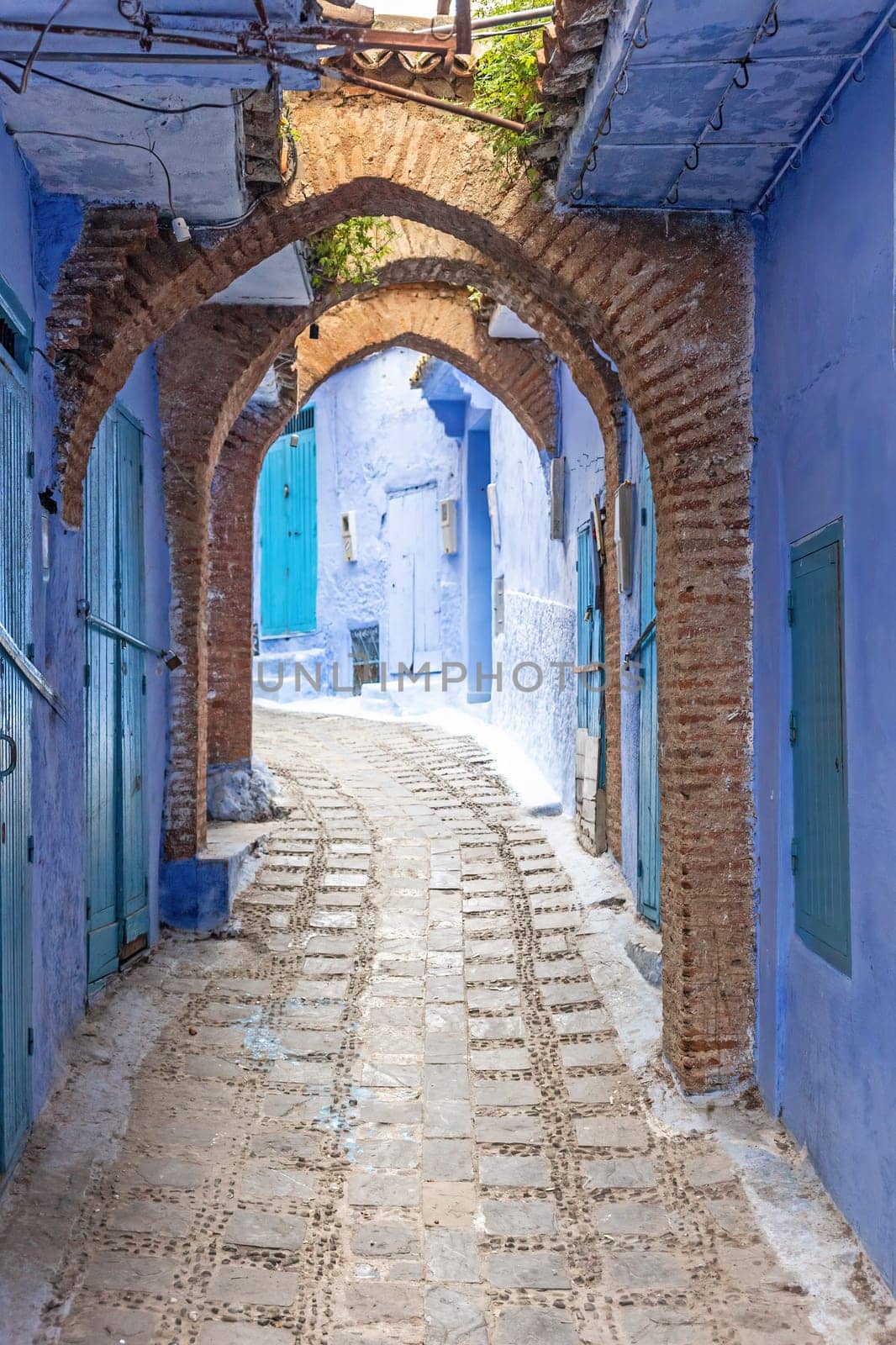 Archway in a blue street in the city of Chefchaouen. Morocco.