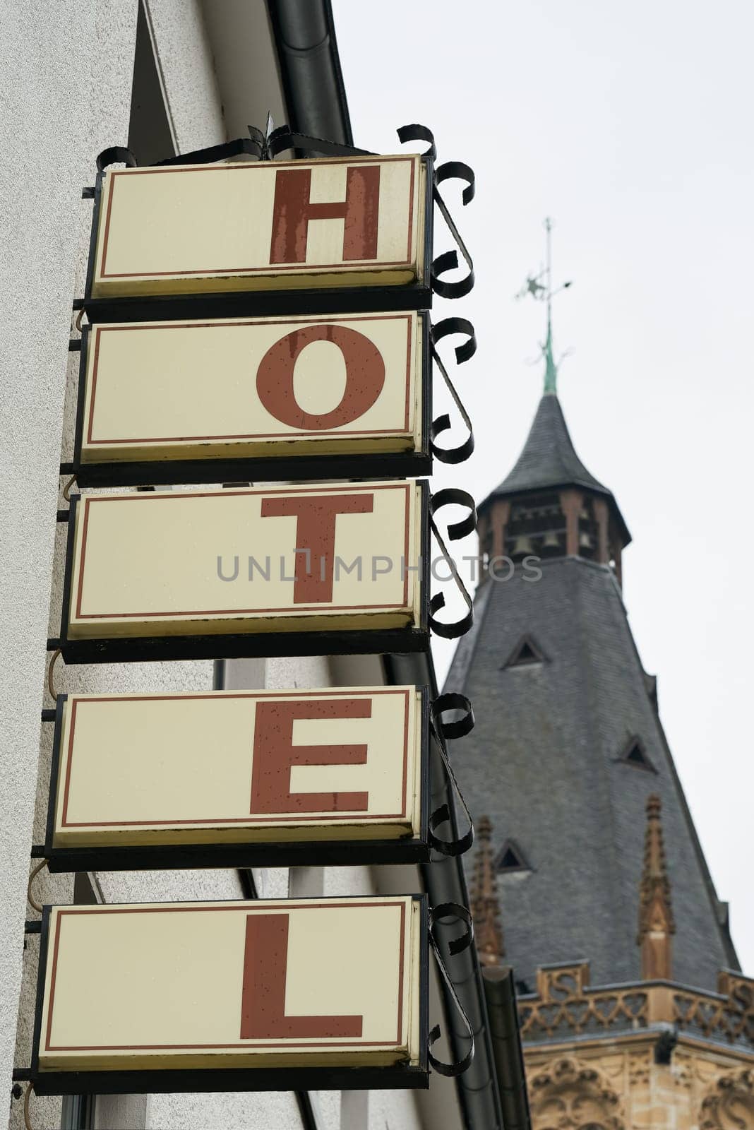 neon sign on the wall of a hotel in the city center of Cologne