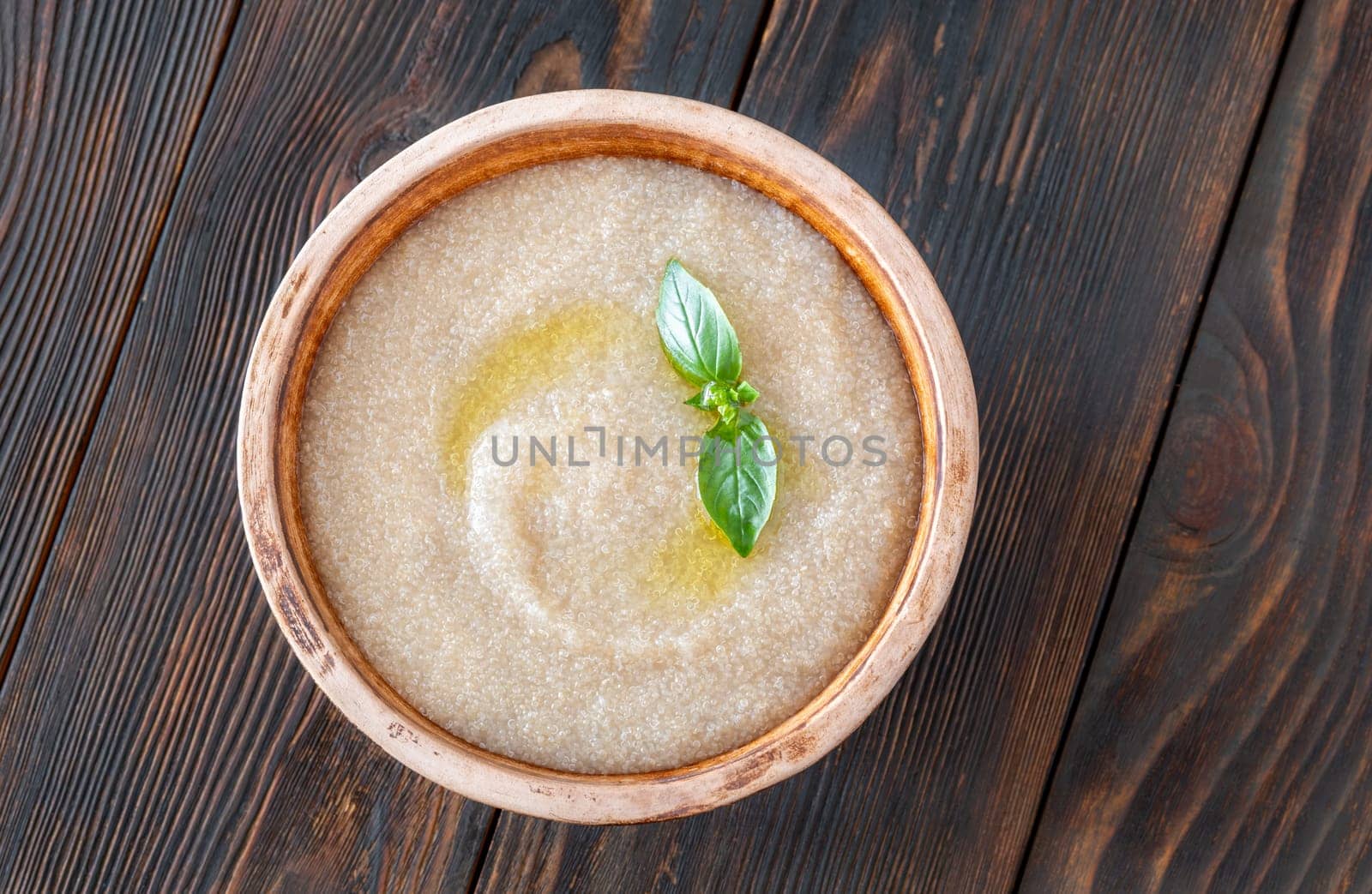Bowl of Amaranth Porridge on wooden background