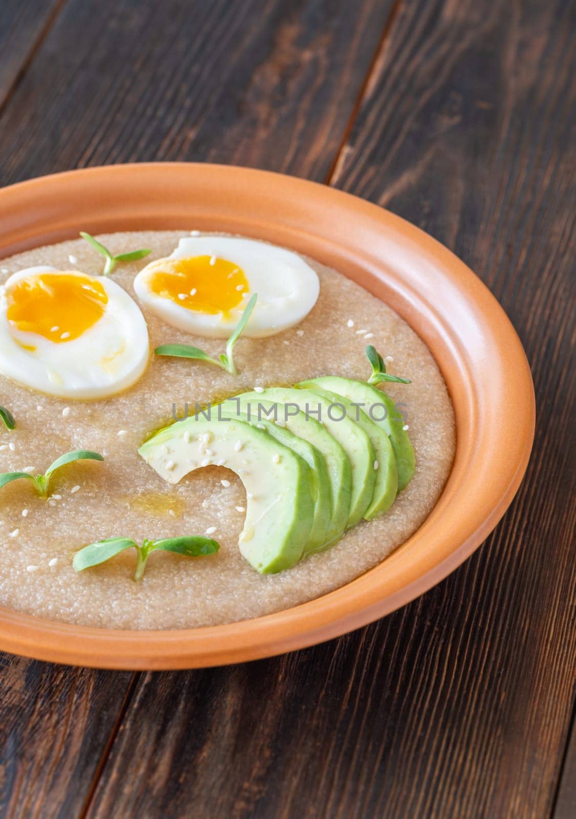 Amaranth Porridge bowl with eggs and avocado