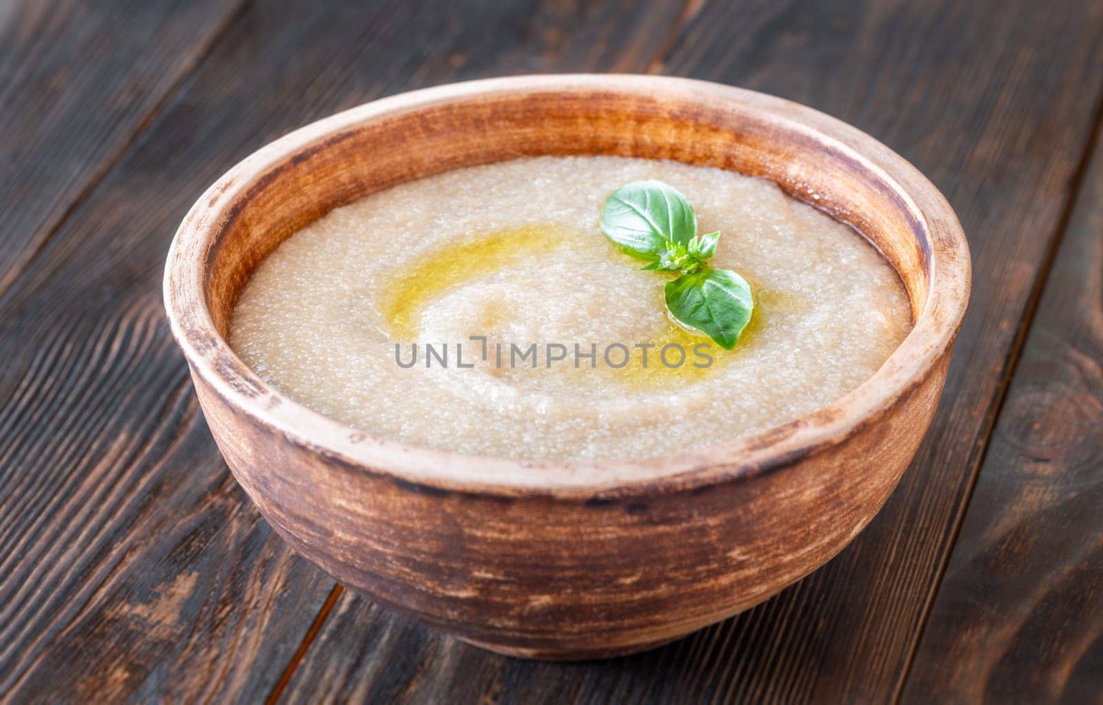 Bowl of Amaranth Porridge on wooden background