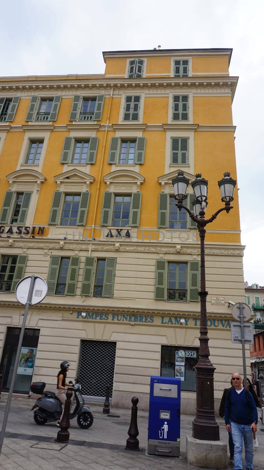 Nice, France - September 22, 2024: People going near beautiful architecture of Nice, south France