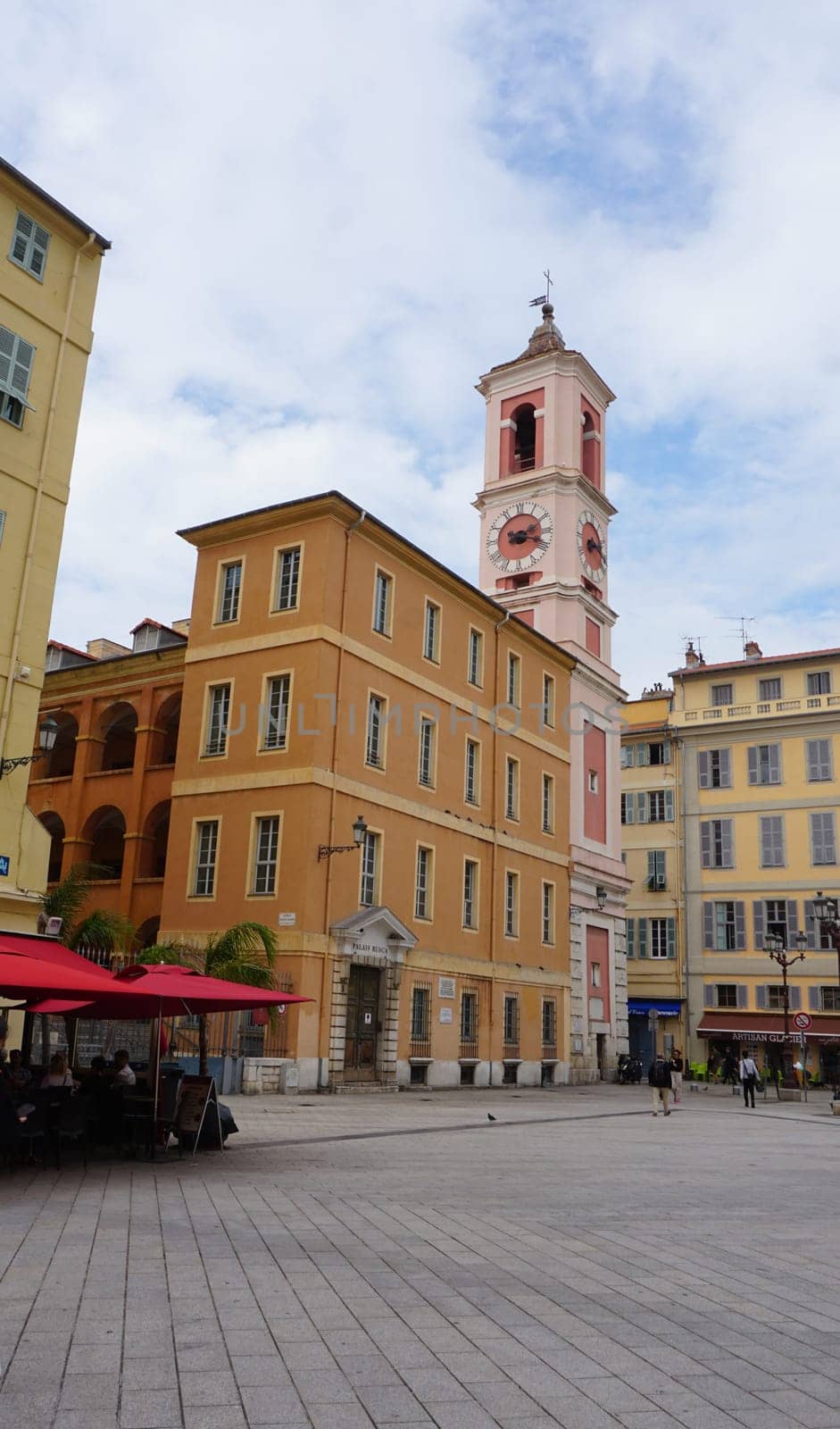Nice, France - September 22, 2024: Palais Rusca Palace and Tour de l'Horloge clock tower at Place du Palais de Justice Palace square in historic Vieux Vieille Ville old town of Nice