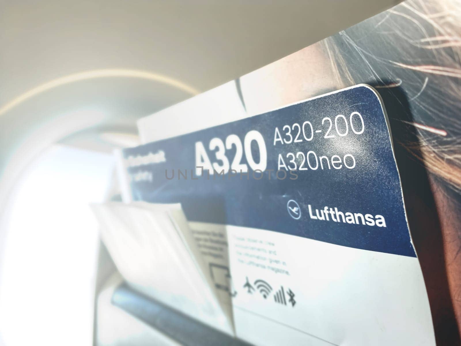 Frankfurt, DE, May 22 2022  Close-up of a Lufthansa A320 safety card placed in the seat pocket of an airplane. The card displays details about A320-200 and A320neo models