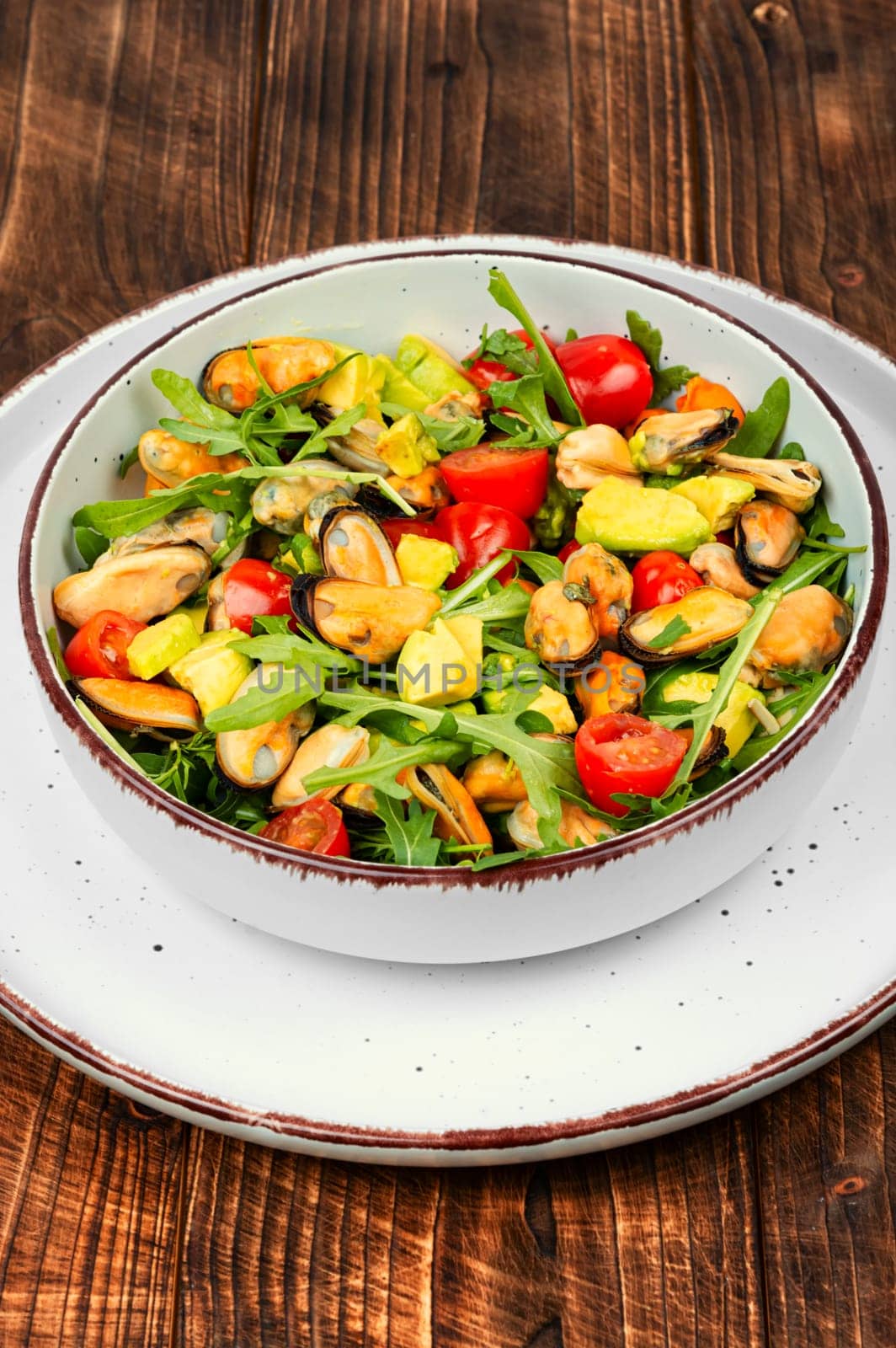 Seafood salad with vegetables and mussels.