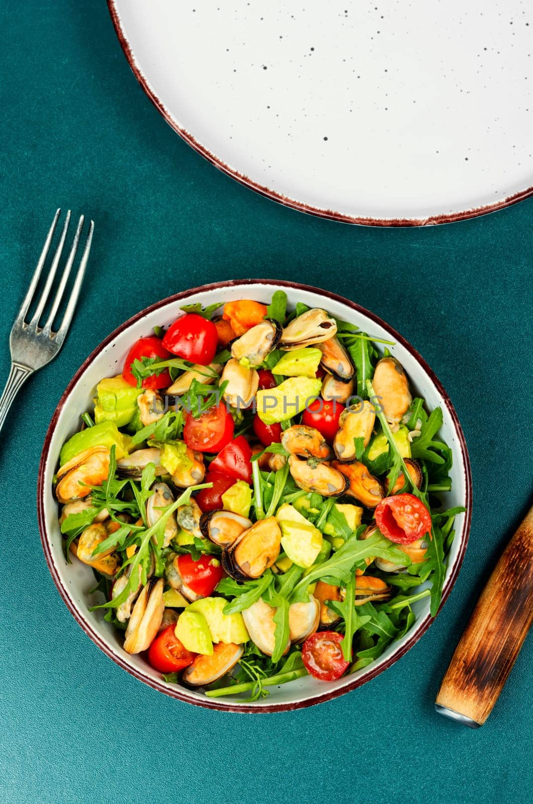 Seafood salad with vegetables and mussels.
