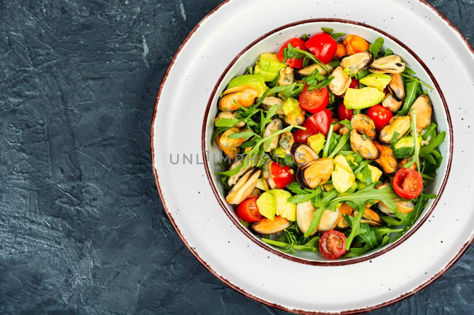 Seafood salad with vegetables and mussels.