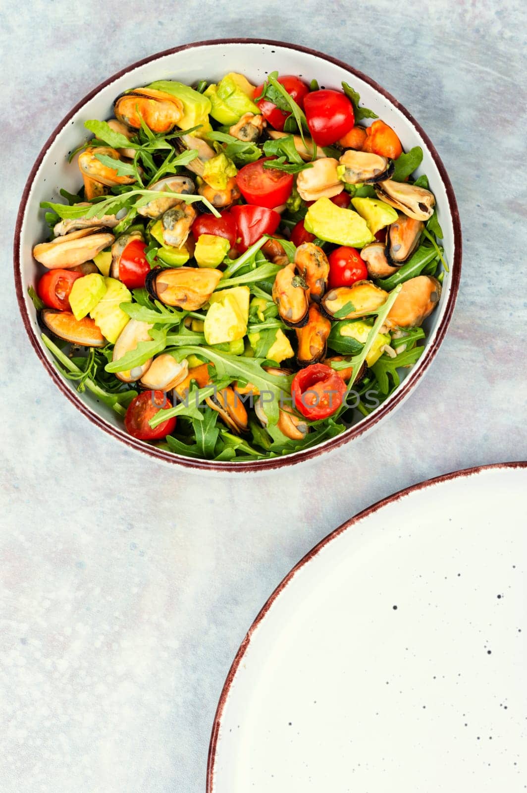 Seafood salad with vegetables and mussels.