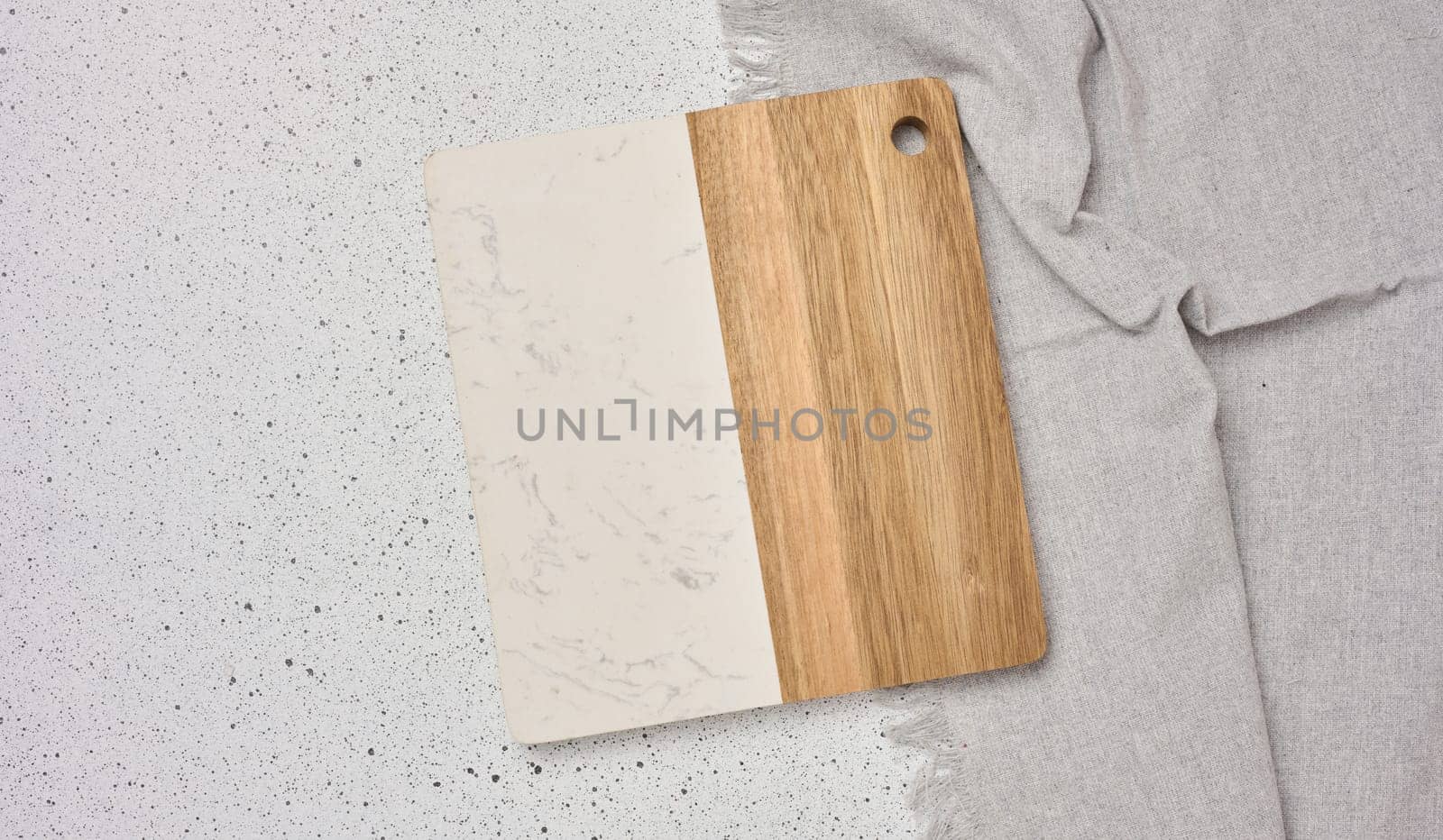 Empty wooden kitchen cutting board on a white background, top view